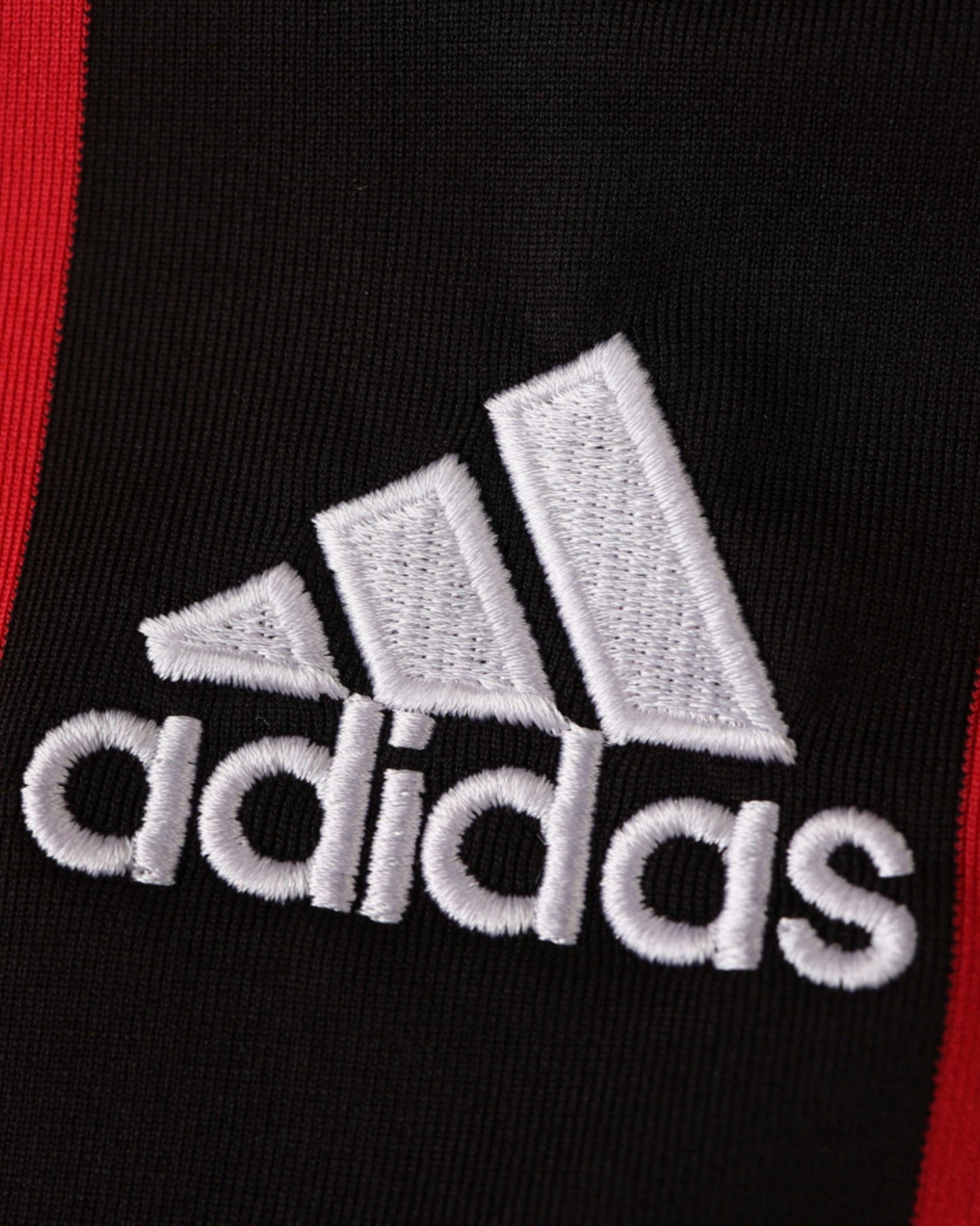 Embroidered white adidas logo on the AC Milan retro home 2006/07 football shirt