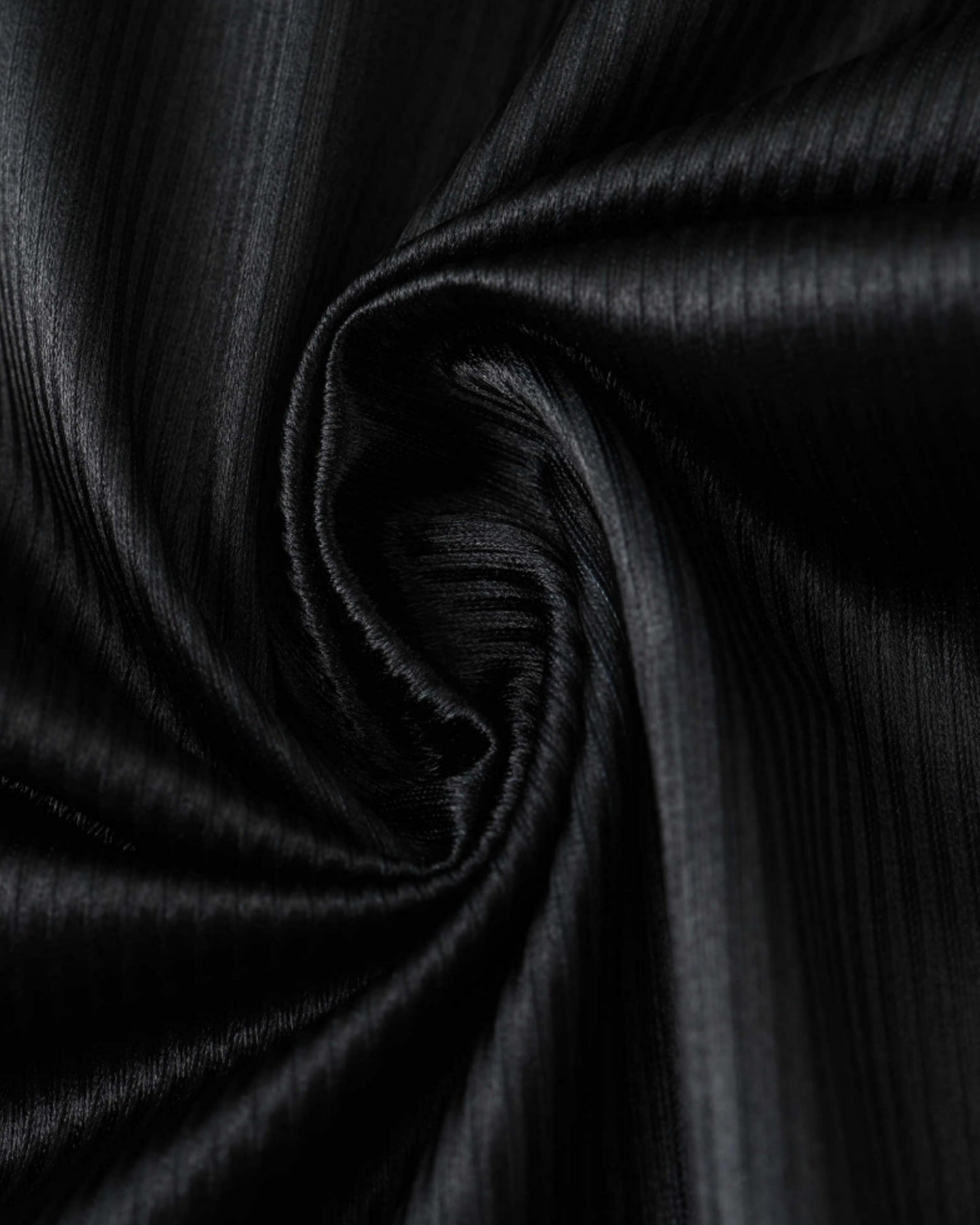 Close-up of the black ribbed fabric on the AC Milan 1998/99 retro third football shirt