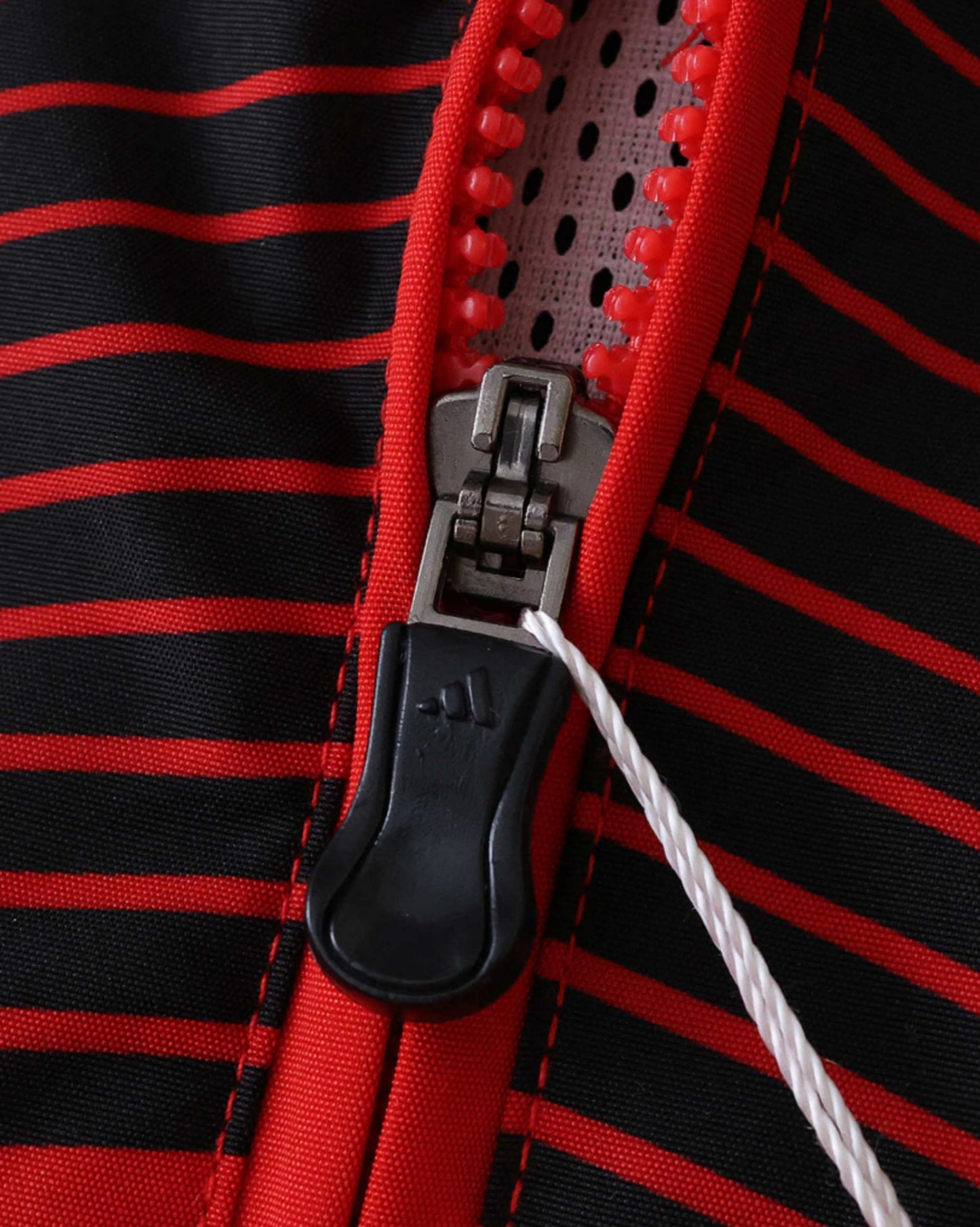 Black and red stripe and zip detail on the AC Milan retro football windbreaker 2006/07