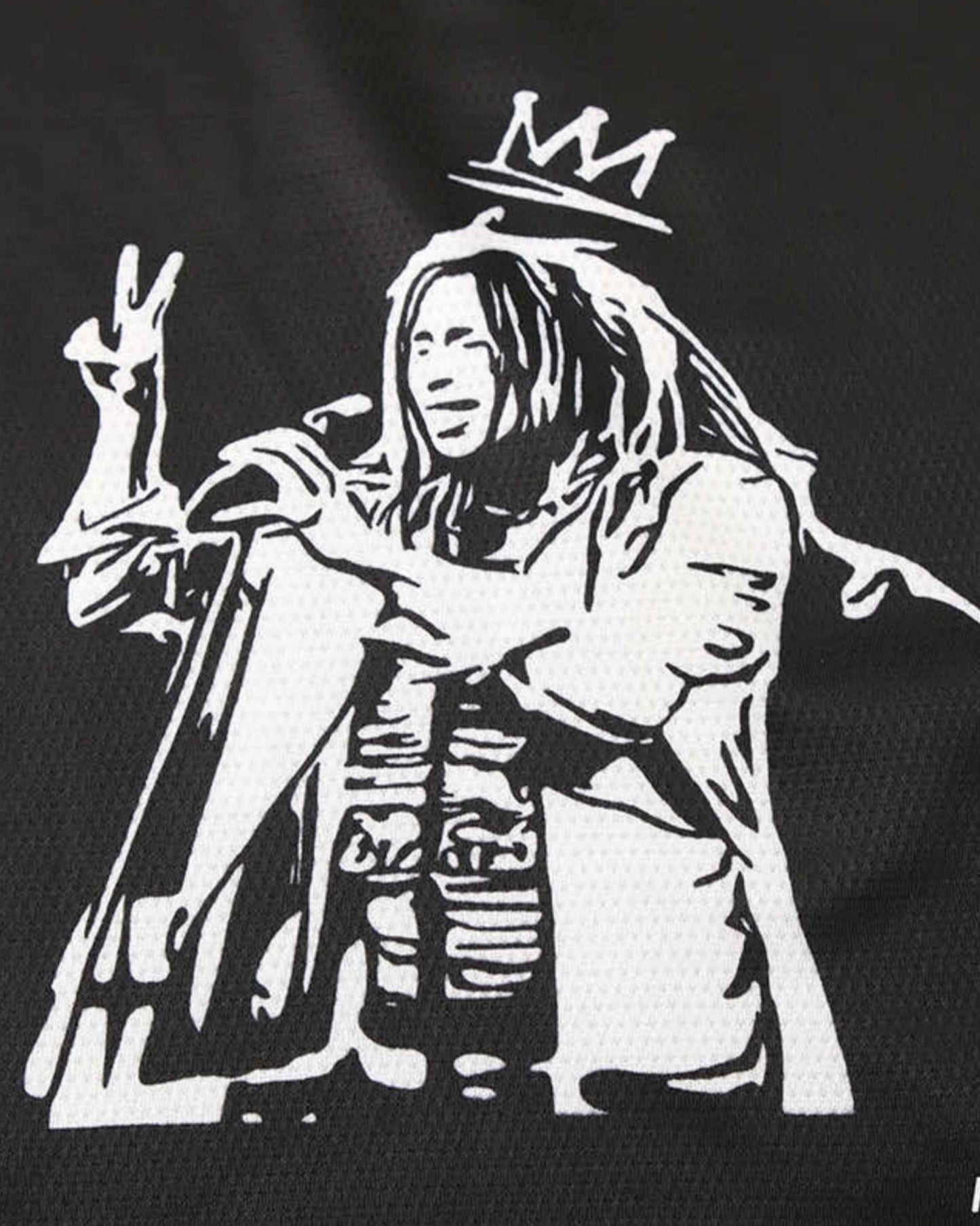 Black Ajax x Bob Marley football jersey 2024 with white Marley stencil wearing crown and peace sign
