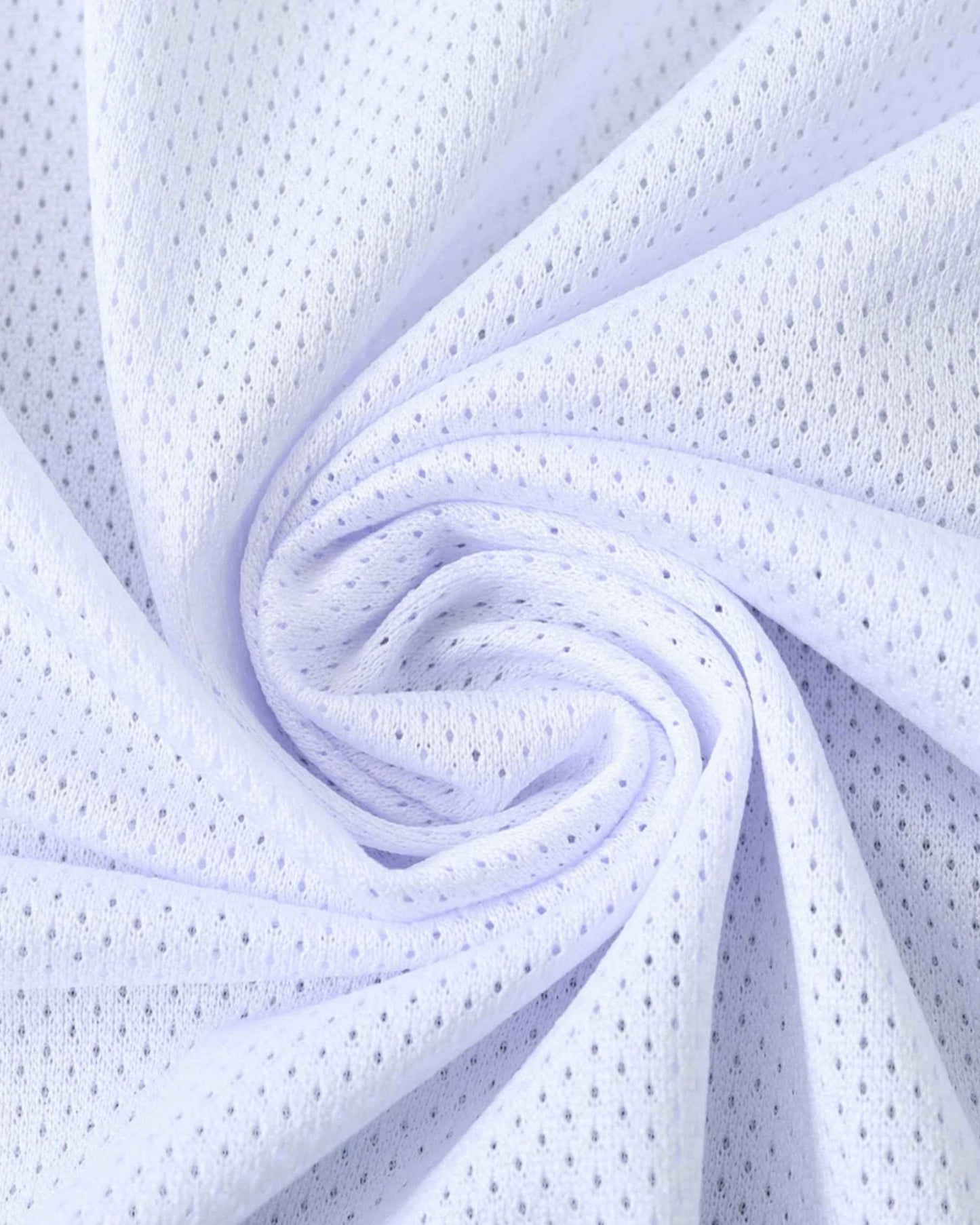 White mesh fabric with small perforations, folded into a swirl.