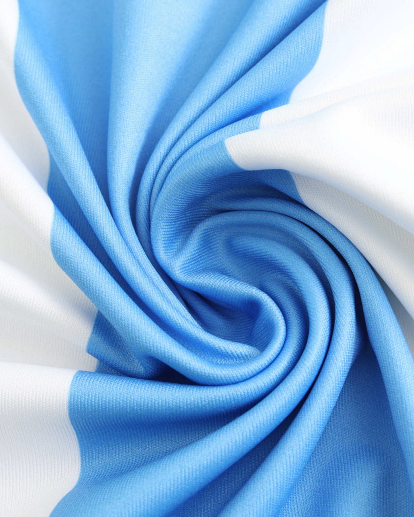 Close-up of white and sky-blue striped fabric of Argentina 2024/25 home football jersey