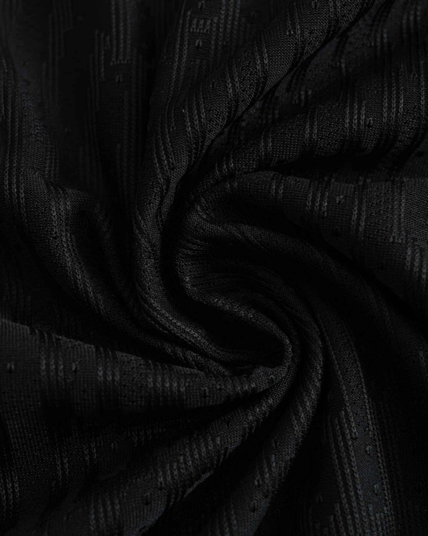Black Footxo Barcelona 2024/25 away jersey with textured pattern.