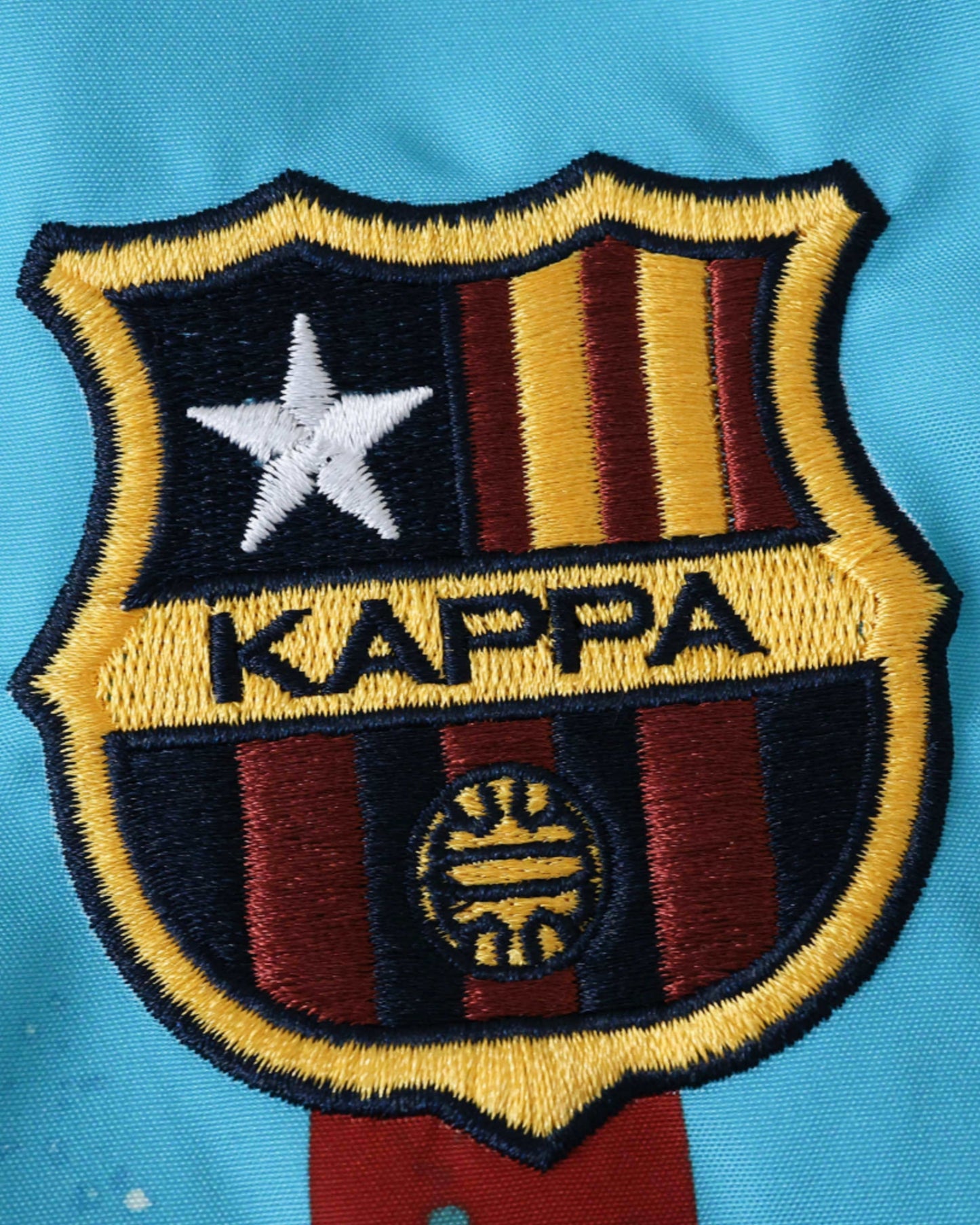FC Barcelona crest and Kappa logo on the sky-blue retro windbreaker 1994/95