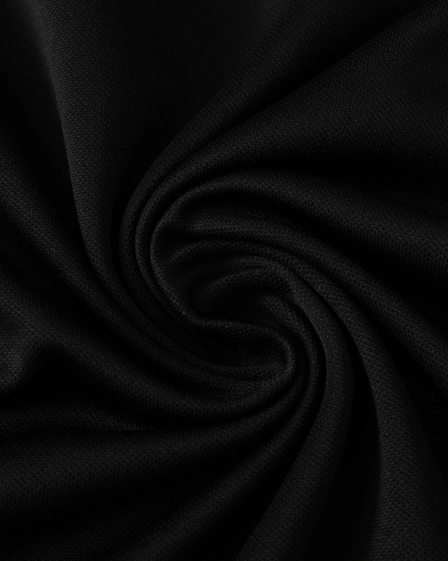 Black football jersey and shorts with a textured fabric.