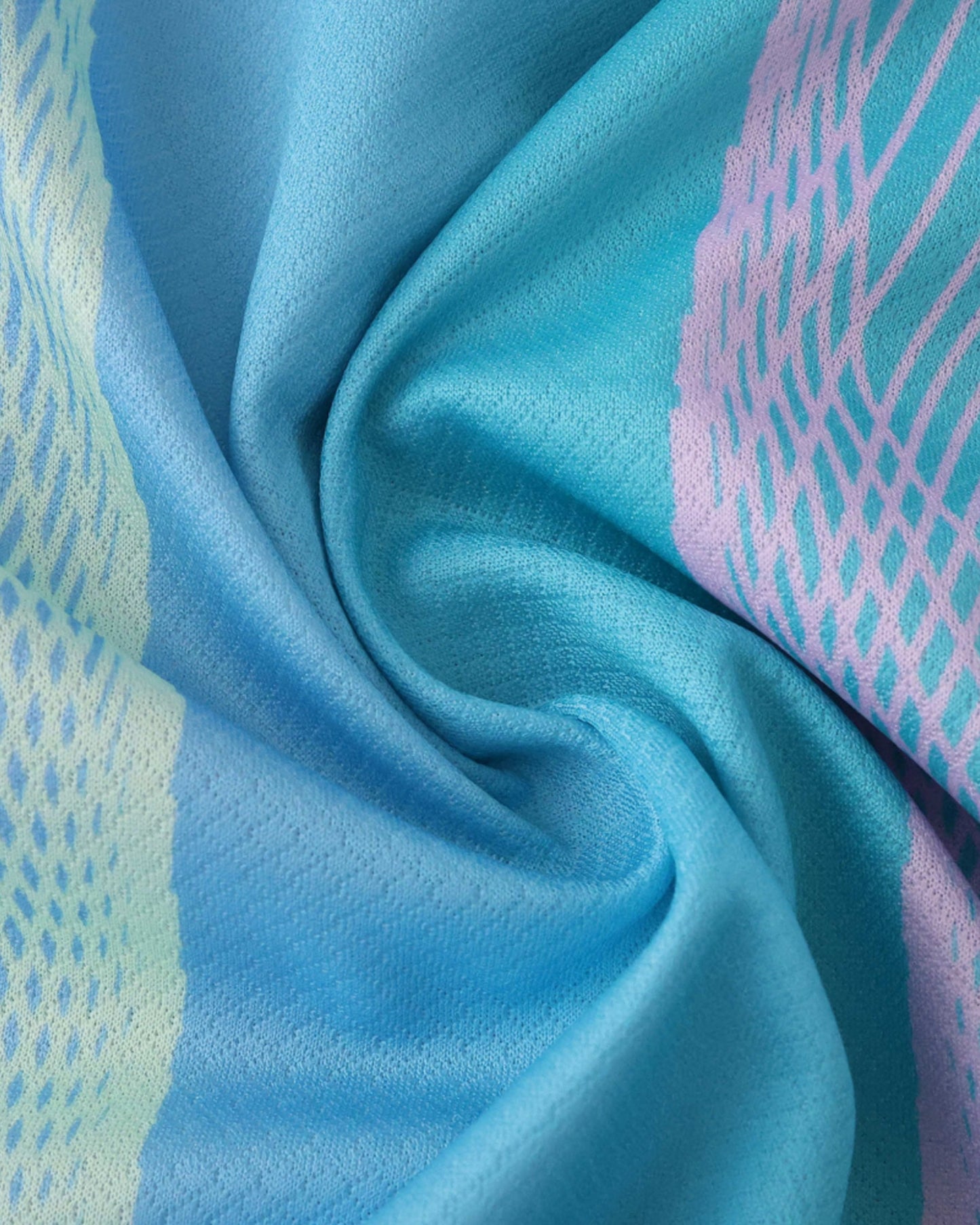 Barcelona x Dreamwave premium football jersey close-up of blue and teal patterned breathable fabric