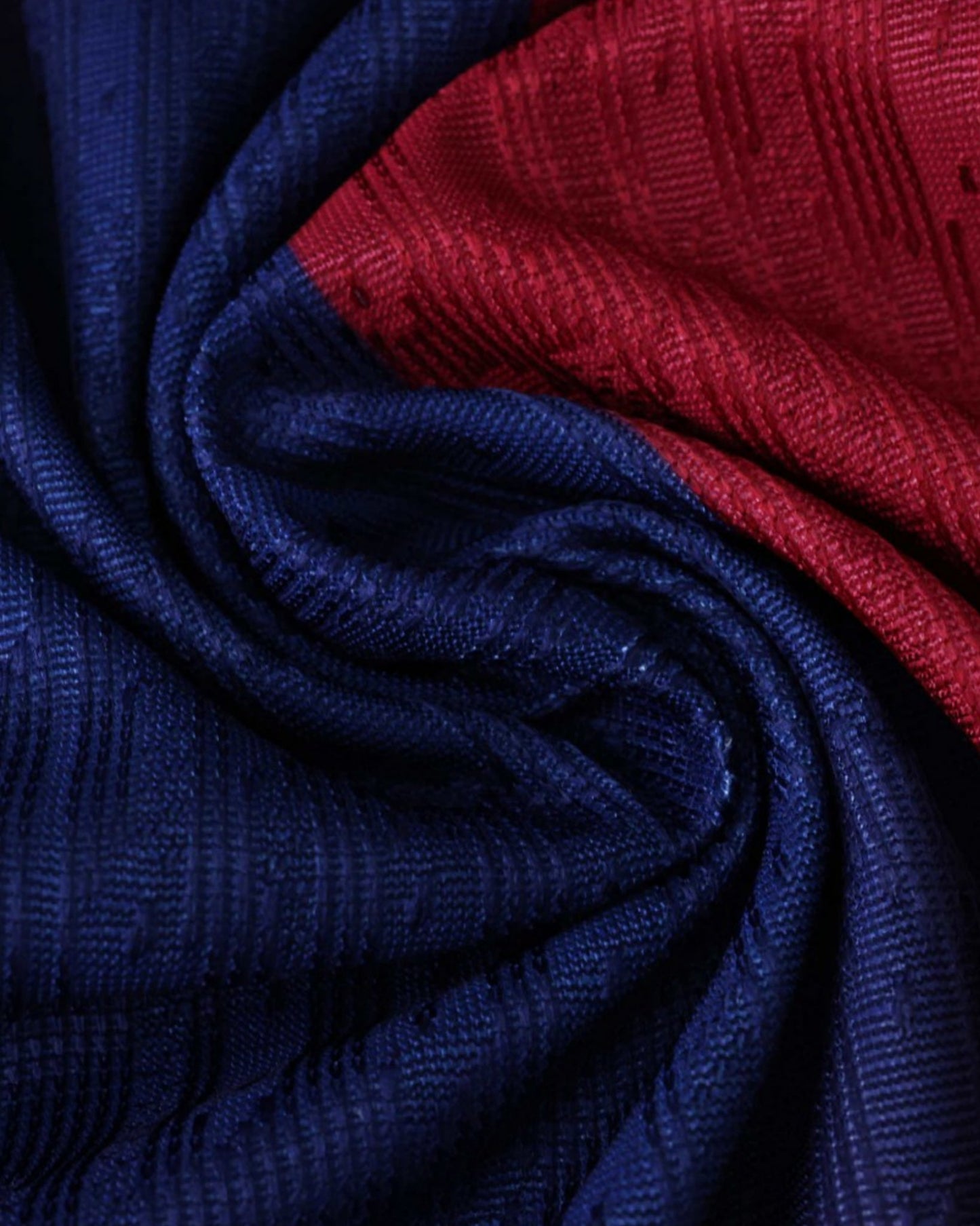 Barcelona x Ed Sheeran football jersey fabric close-up showing blue and red striped weave