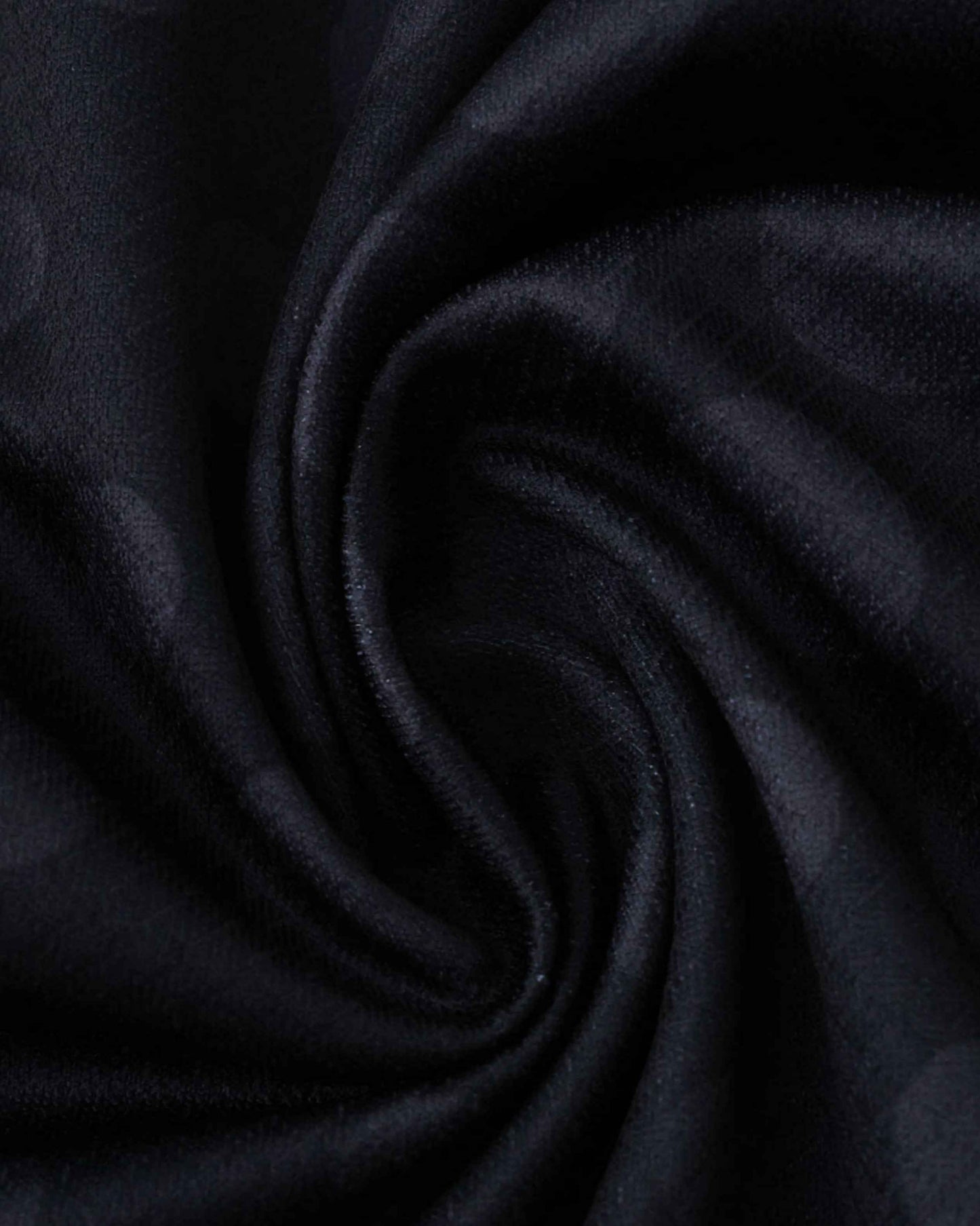 Black fabric with a subtle pattern and soft texture.