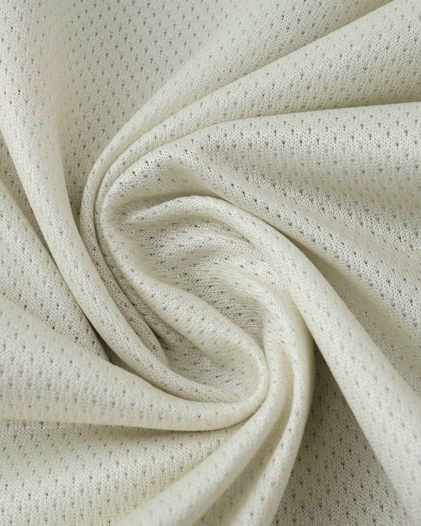 White knit fabric with small perforations, draped in a swirl.