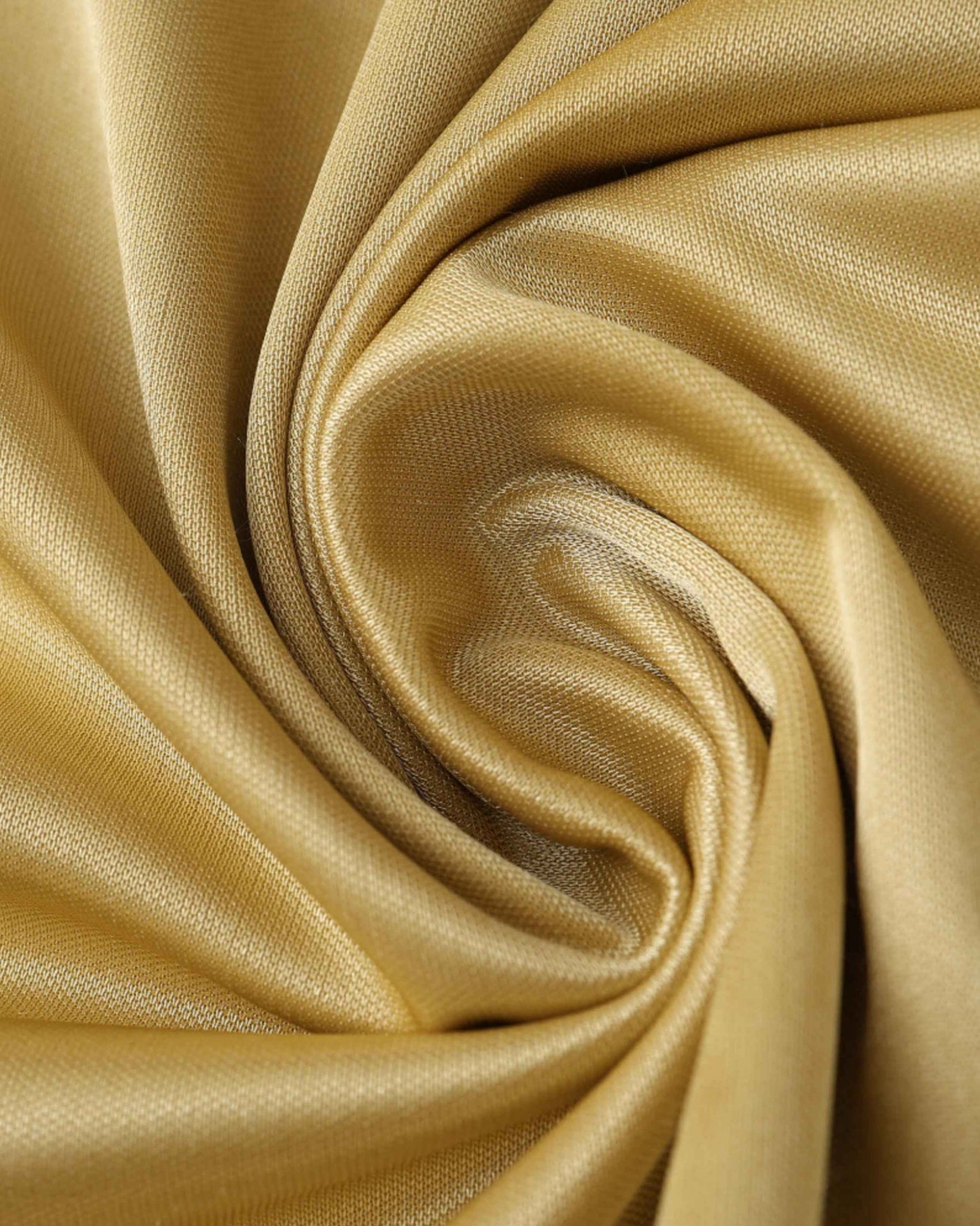 Golden fabric with a subtle weave, draped in soft folds.