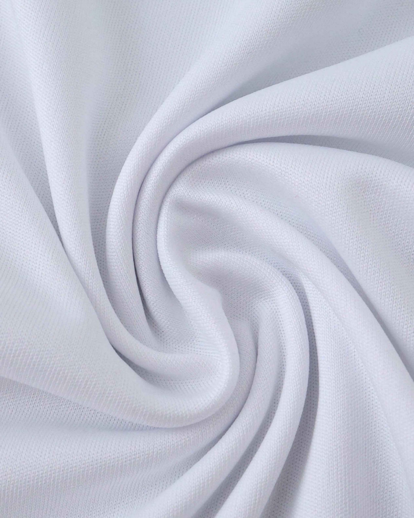 White fabric with a textured knit pattern, folded into soft pleats.