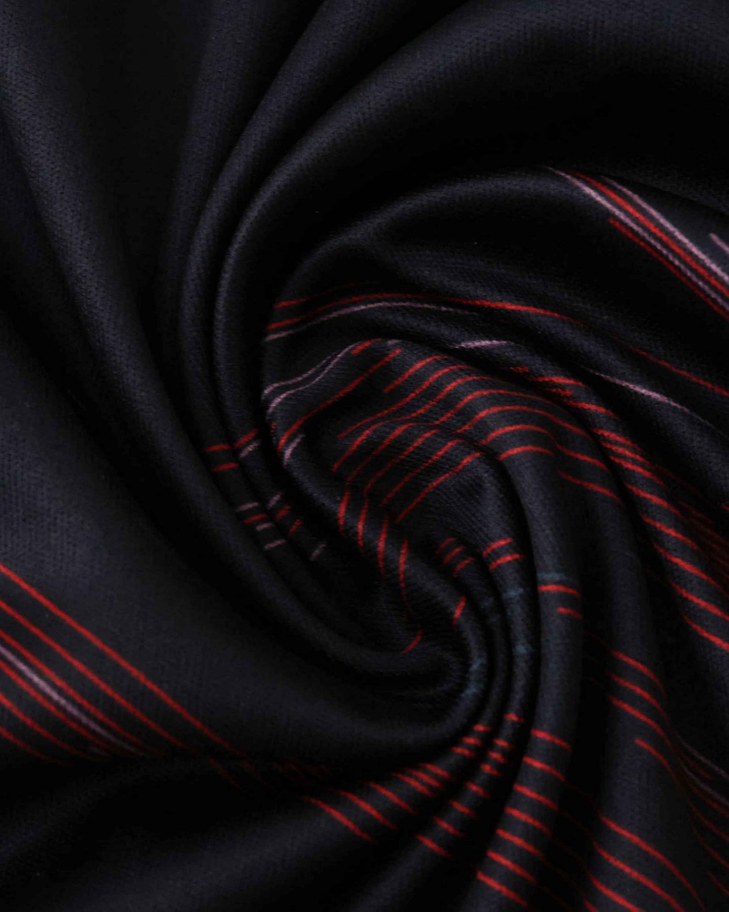 Black fabric with red and white pinstripes, folded into a swirl.