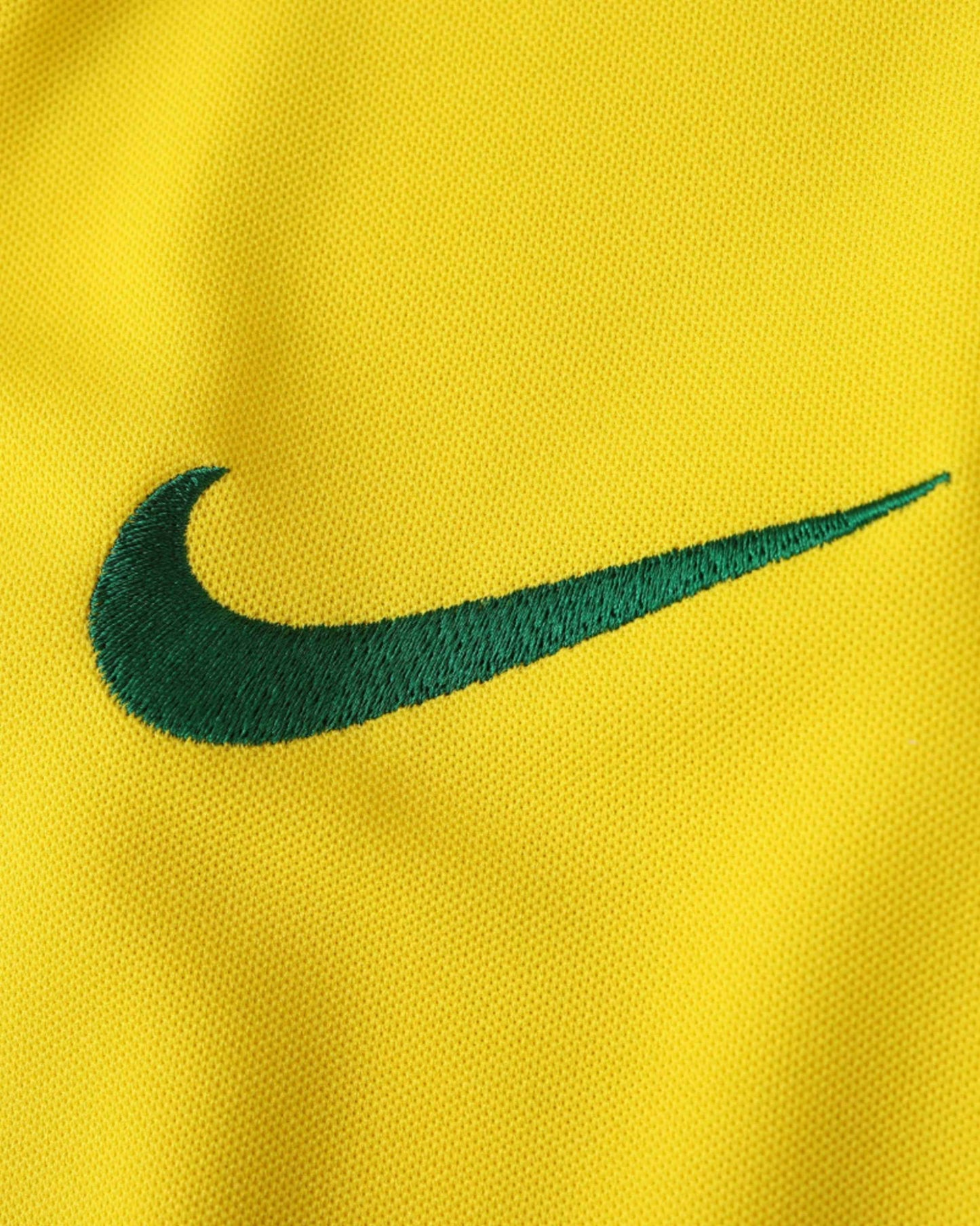 Green Nike swoosh on yellow Brazil retro home football jersey 2003/04