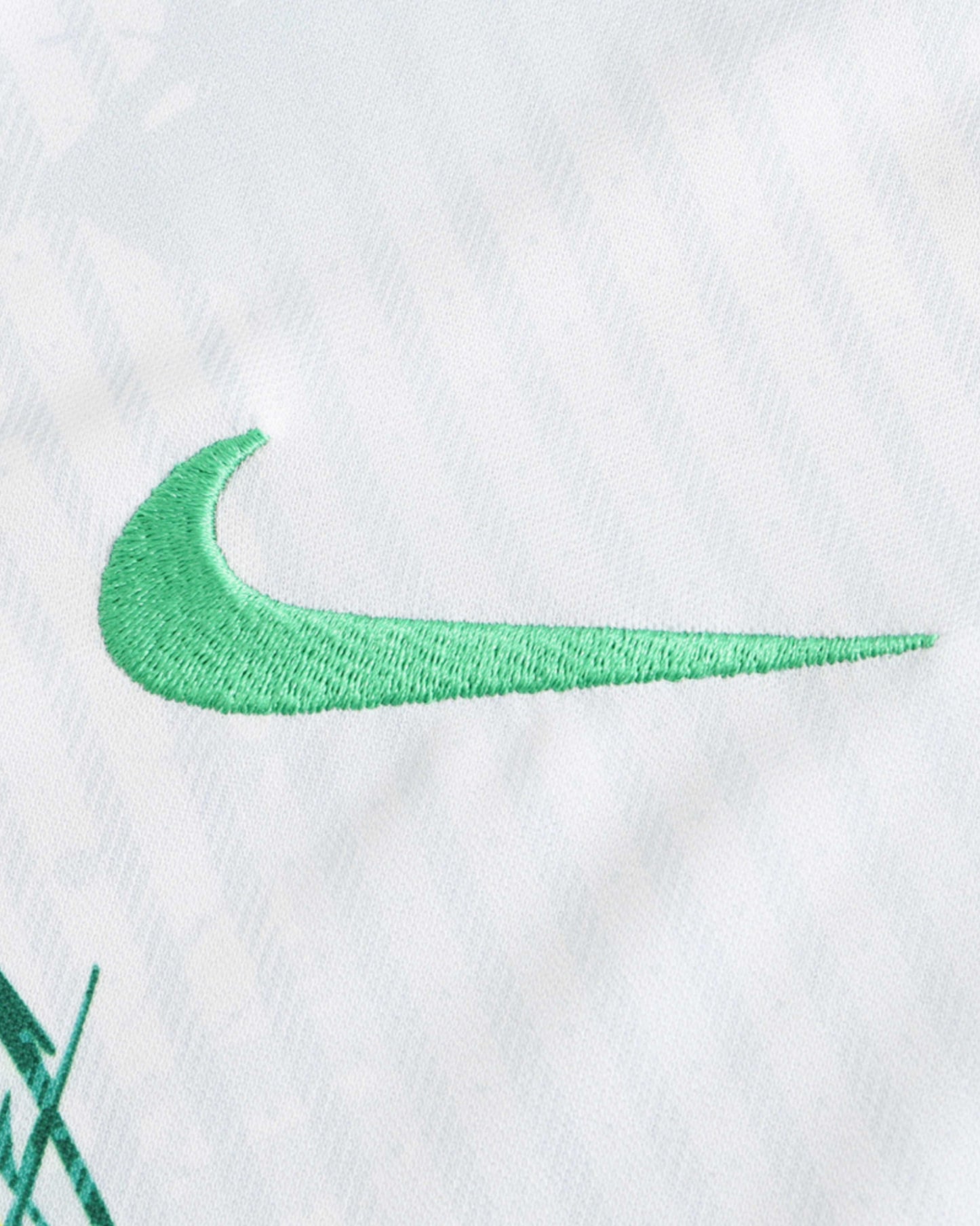 Green Nike swoosh embroidered on white Brazil Canarinho Flight football jersey