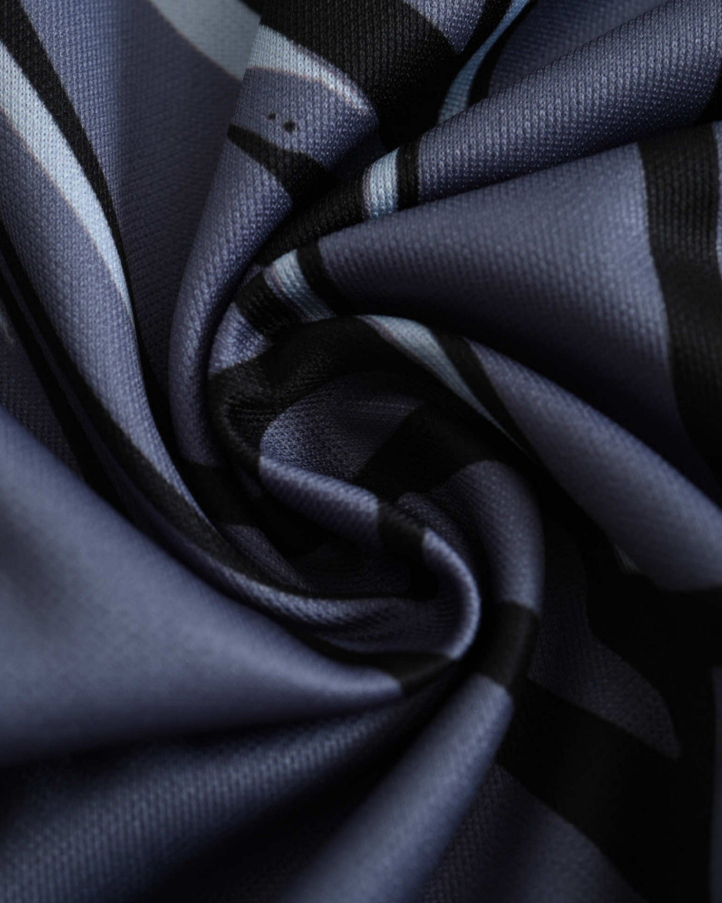 Swirled fabric texture detail of the yellow and blue Brazil x Jesus football jersey