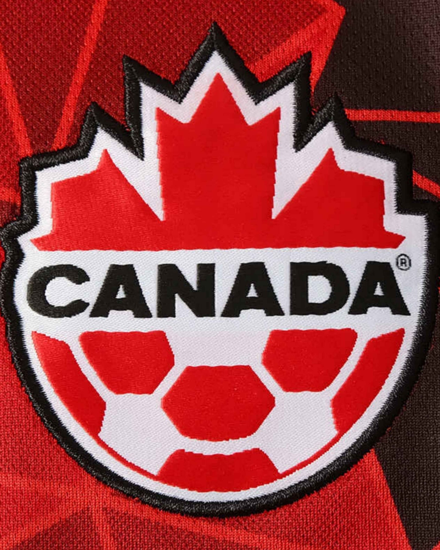 Canada Soccer maple-leaf crest on red Canada home football jersey 2023/24