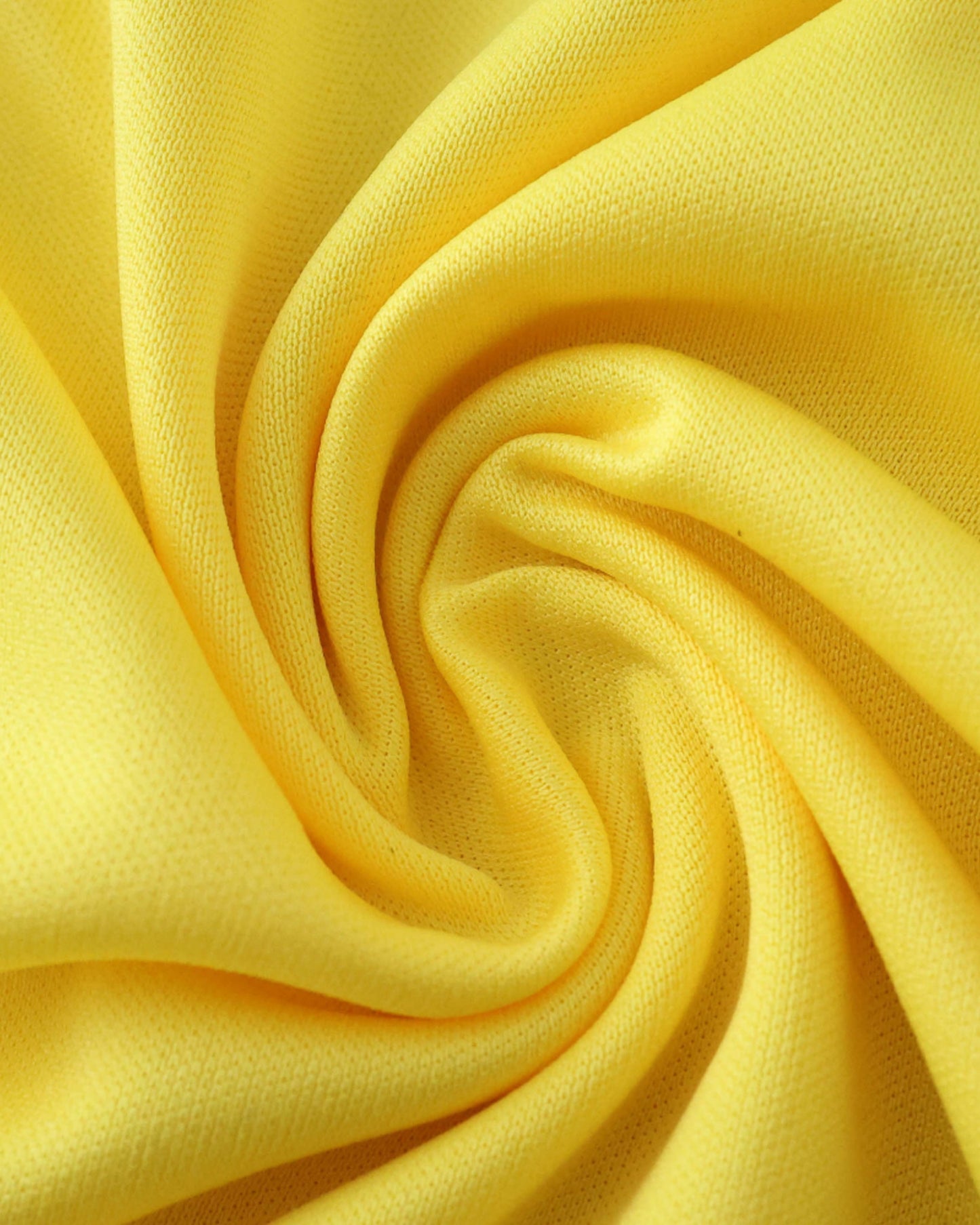 Close-up of yellow textured fabric of Colombia 2001/02 retro home football jersey