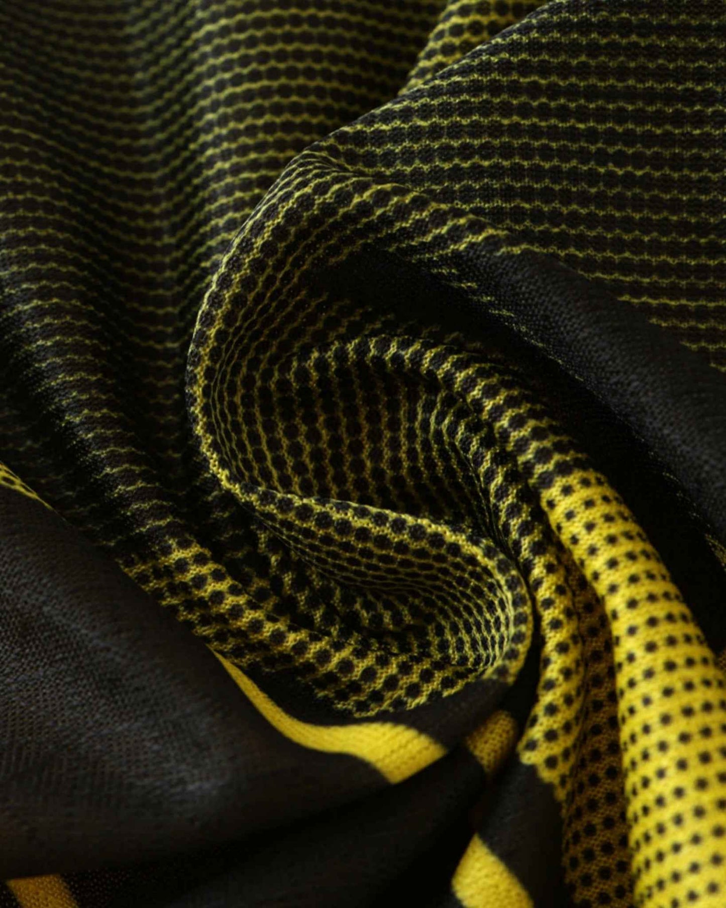 Yellow and black patterned football jersey with a textured honeycomb design.