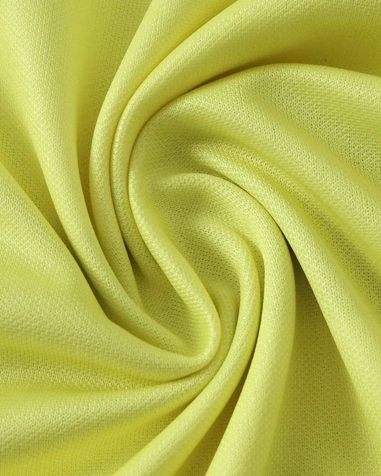 Yellow textured fabric with soft folds.
