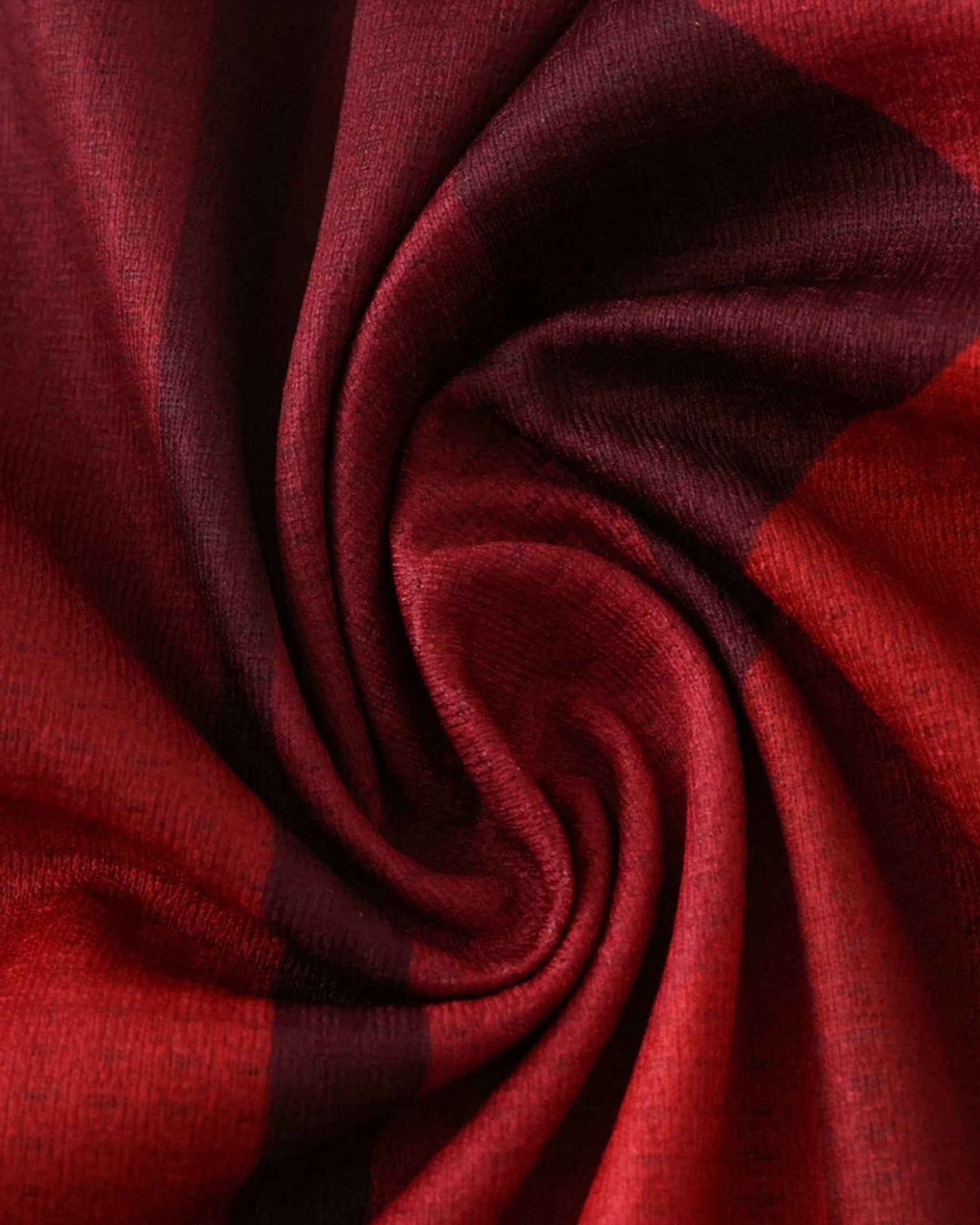 Red and black plaid fabric texture.