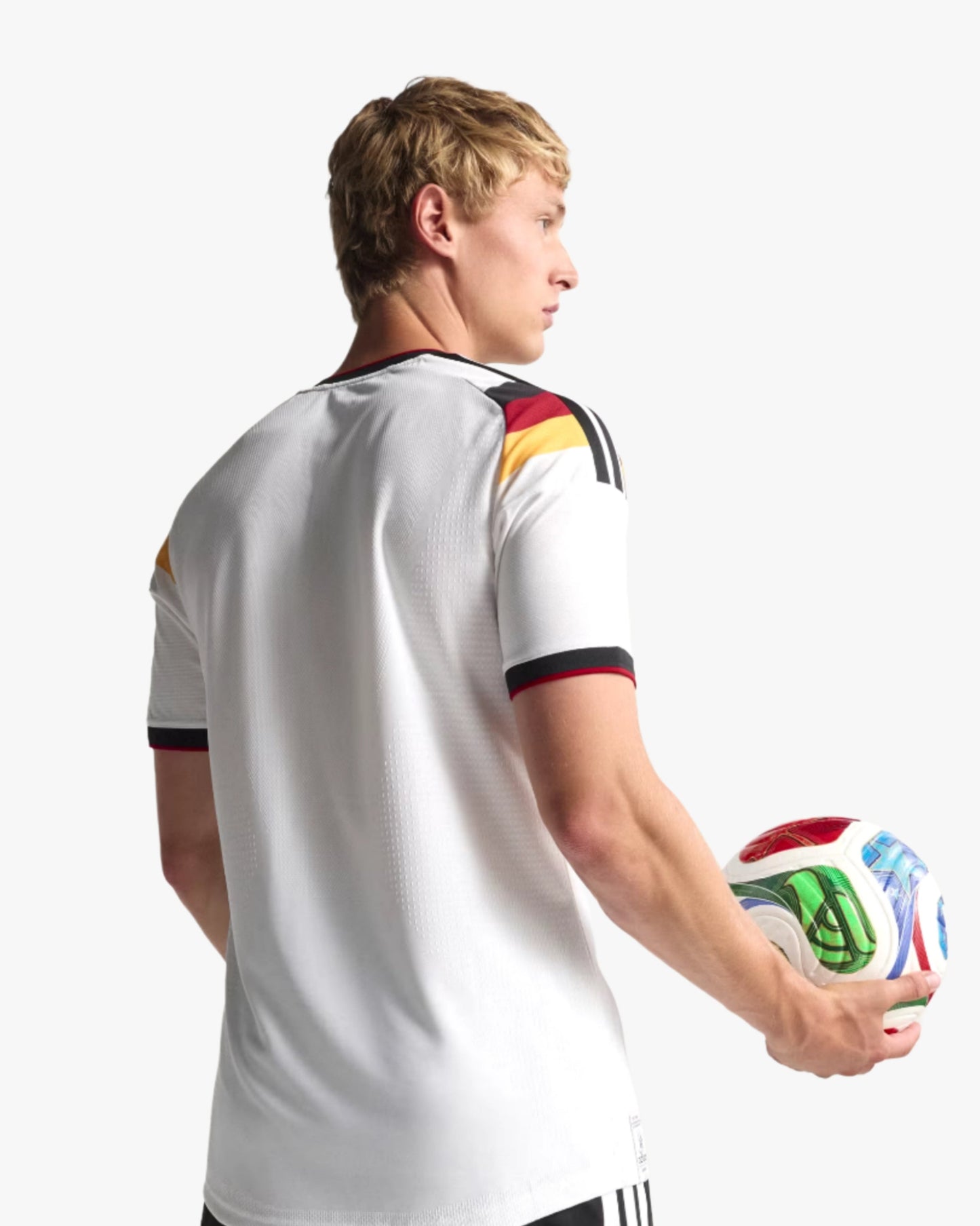 Man holding football in white Germany home football jersey 2026 World Cup