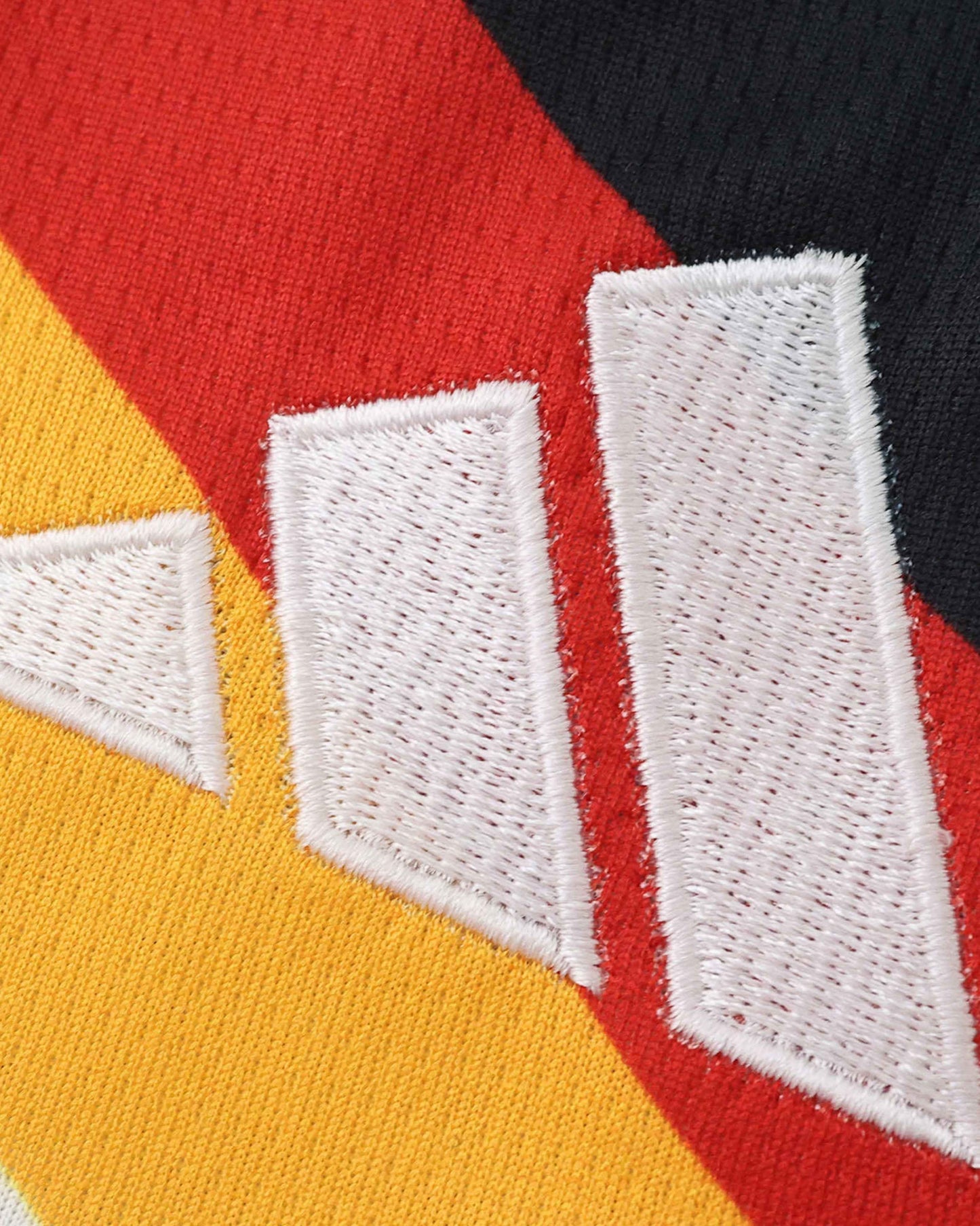 Germany home 2026 World Cup kids football kit detail showing four-star DFB crest and adidas stripes