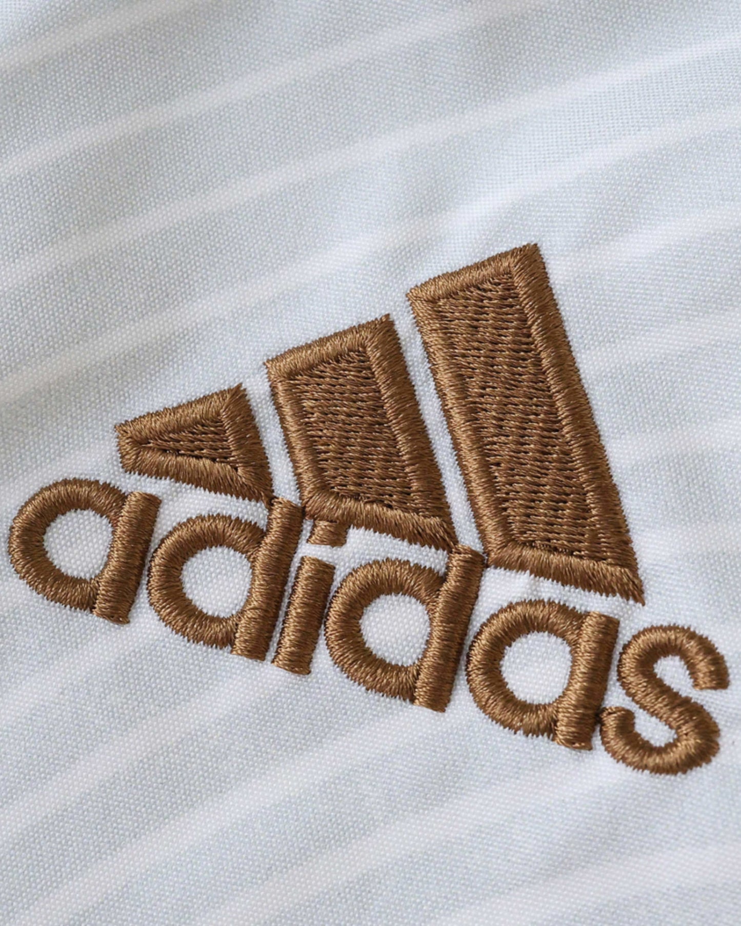 Gold adidas logo on the white Germany retro football windbreaker 2005/06