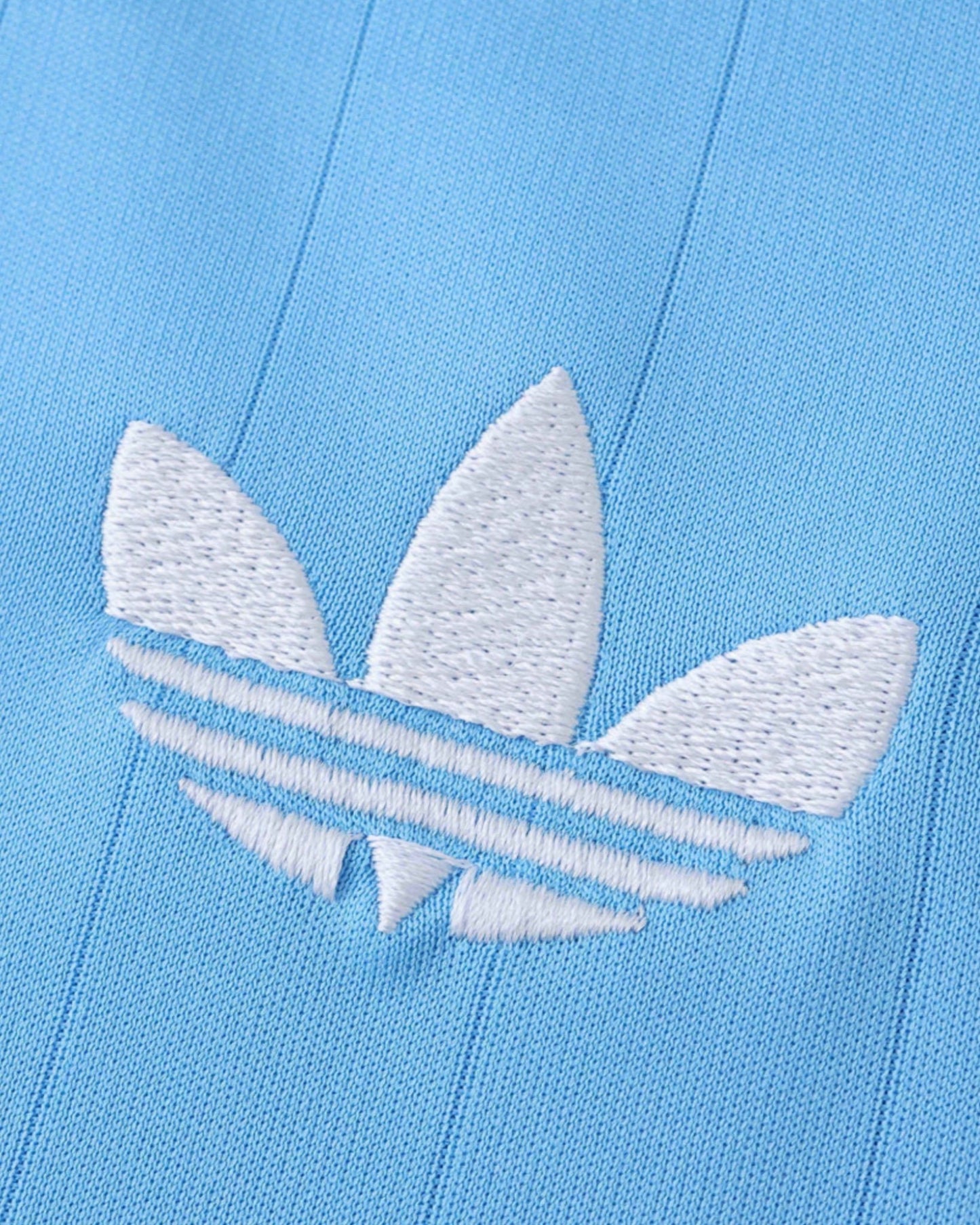 Inter Miami third kids football jersey 2025/26 close-up of white Adidas logo on sky blue fabric