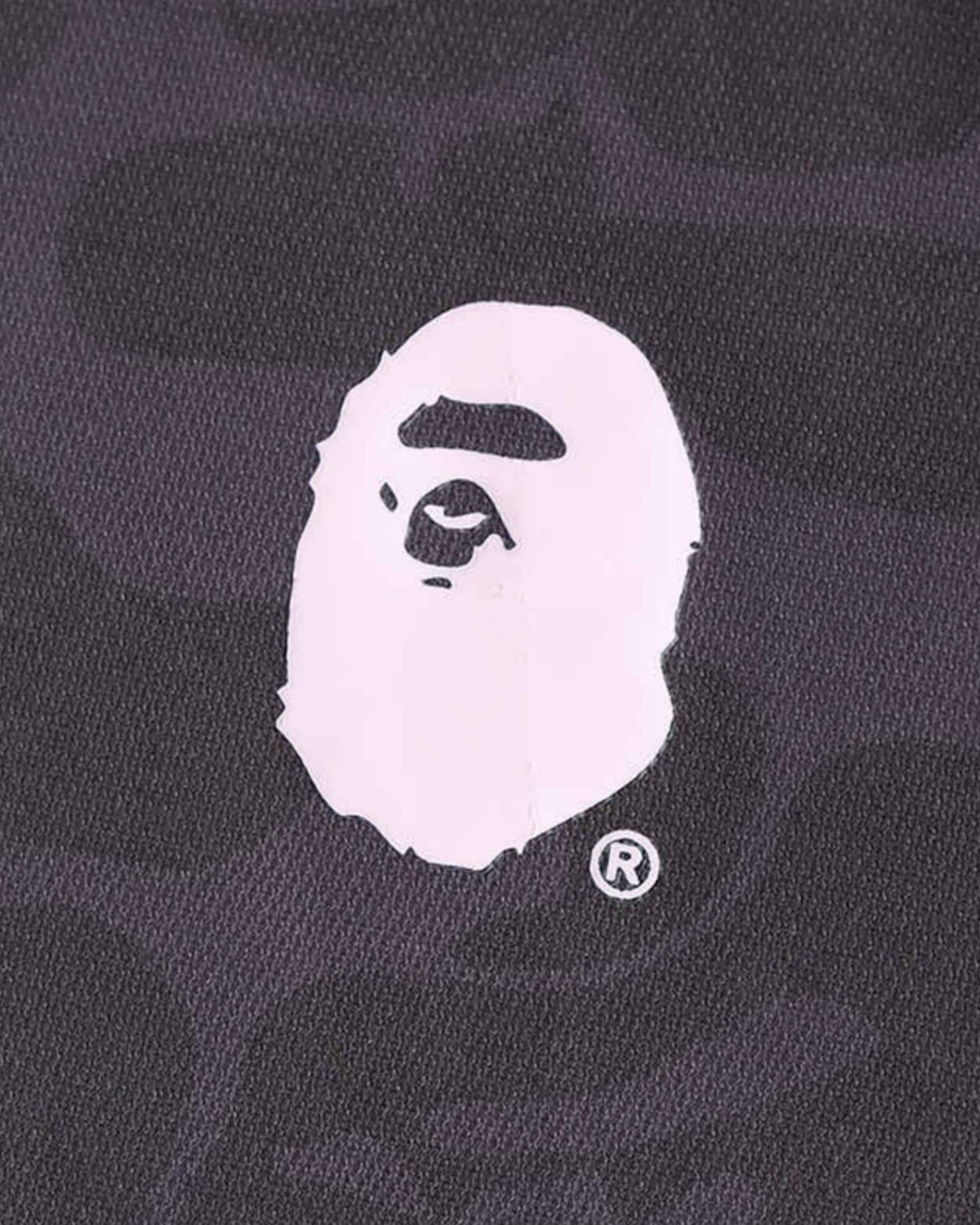 Inter Miami x BAPE soccer jersey with ape head logo and registered trademark symbol.