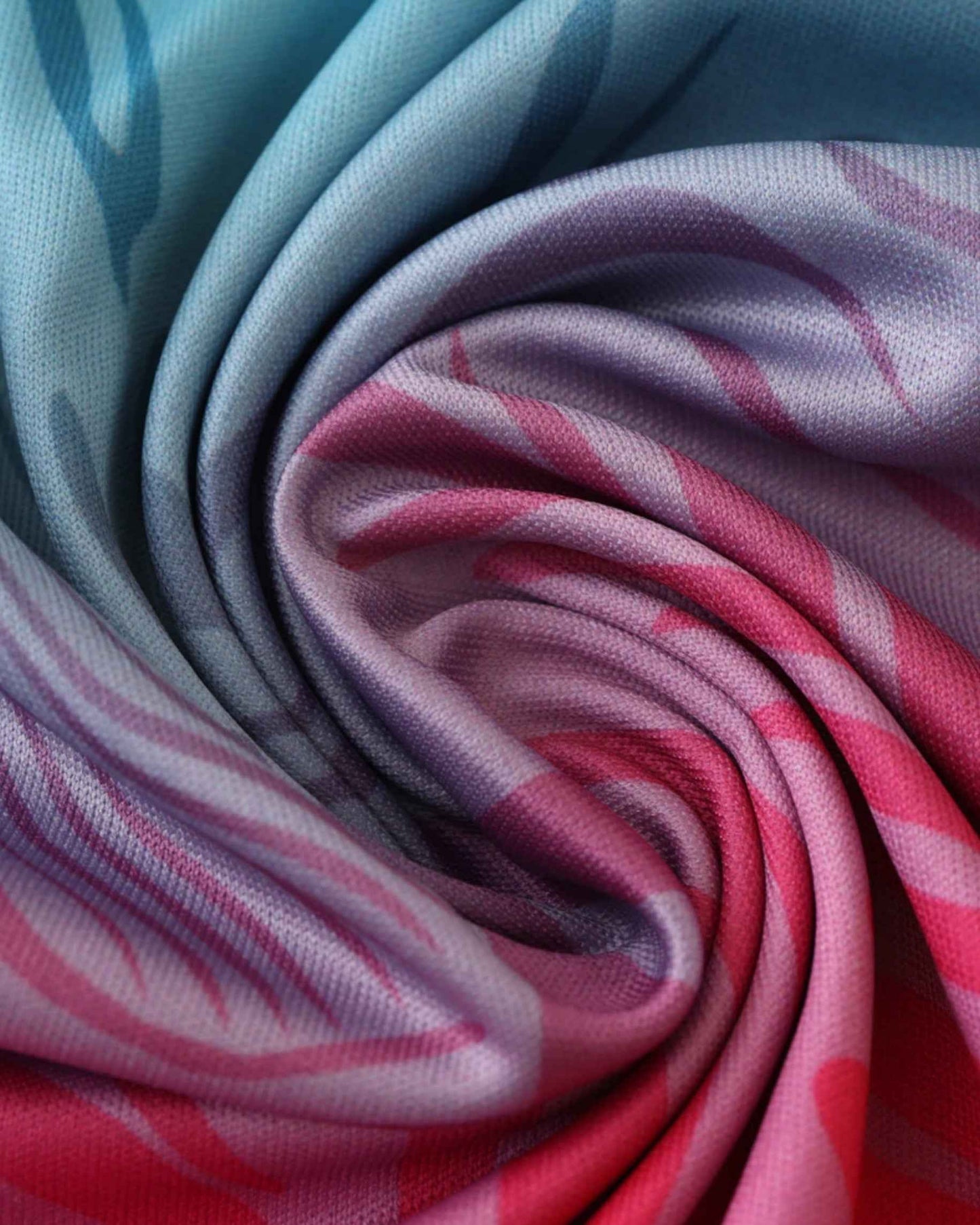 Close-up of Inter Miami Miami Beach football jersey turquoise and pink gradient palm-leaf fabric