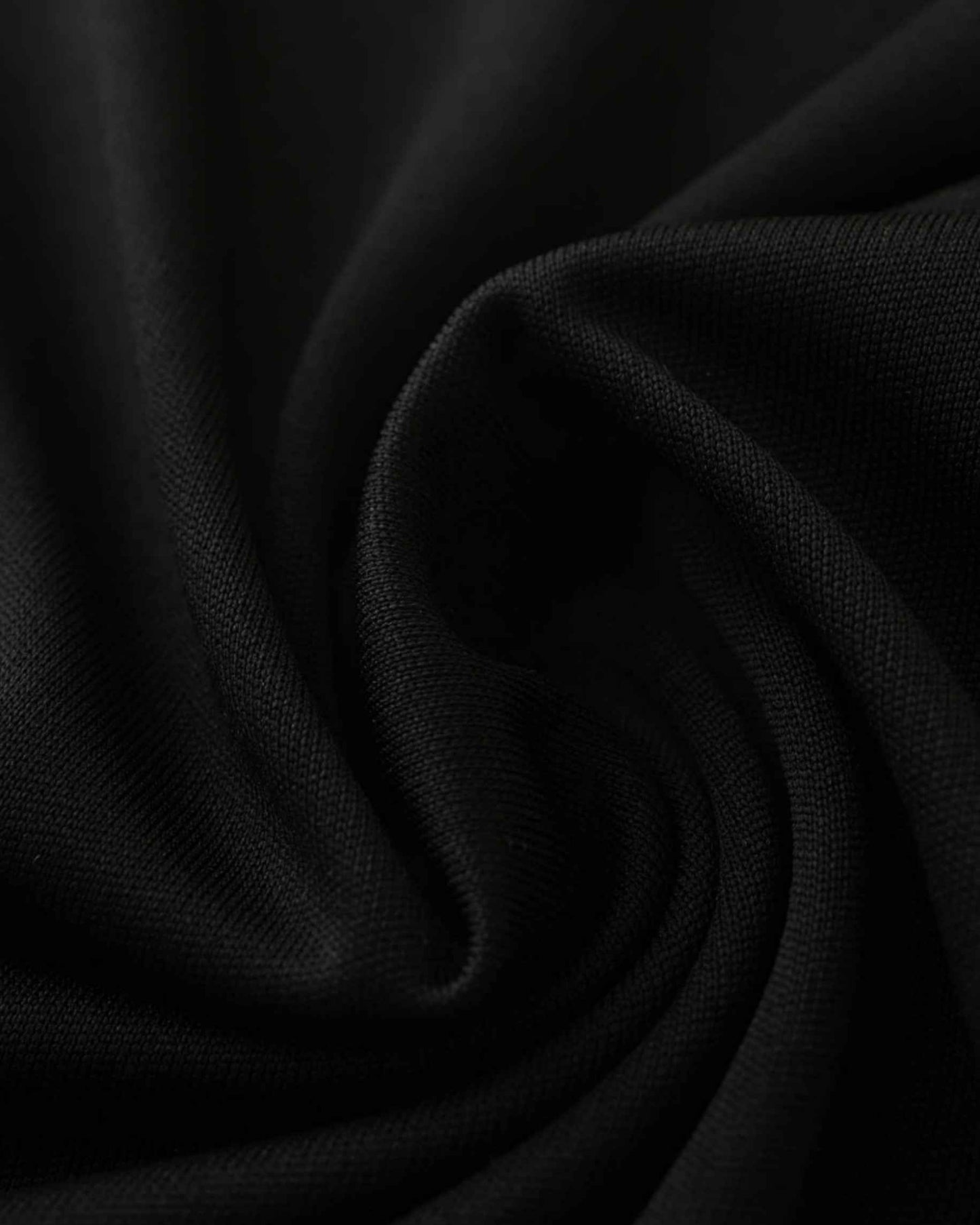 Close-up of black breathable fabric on the Inter Miami Neon Beach football jersey