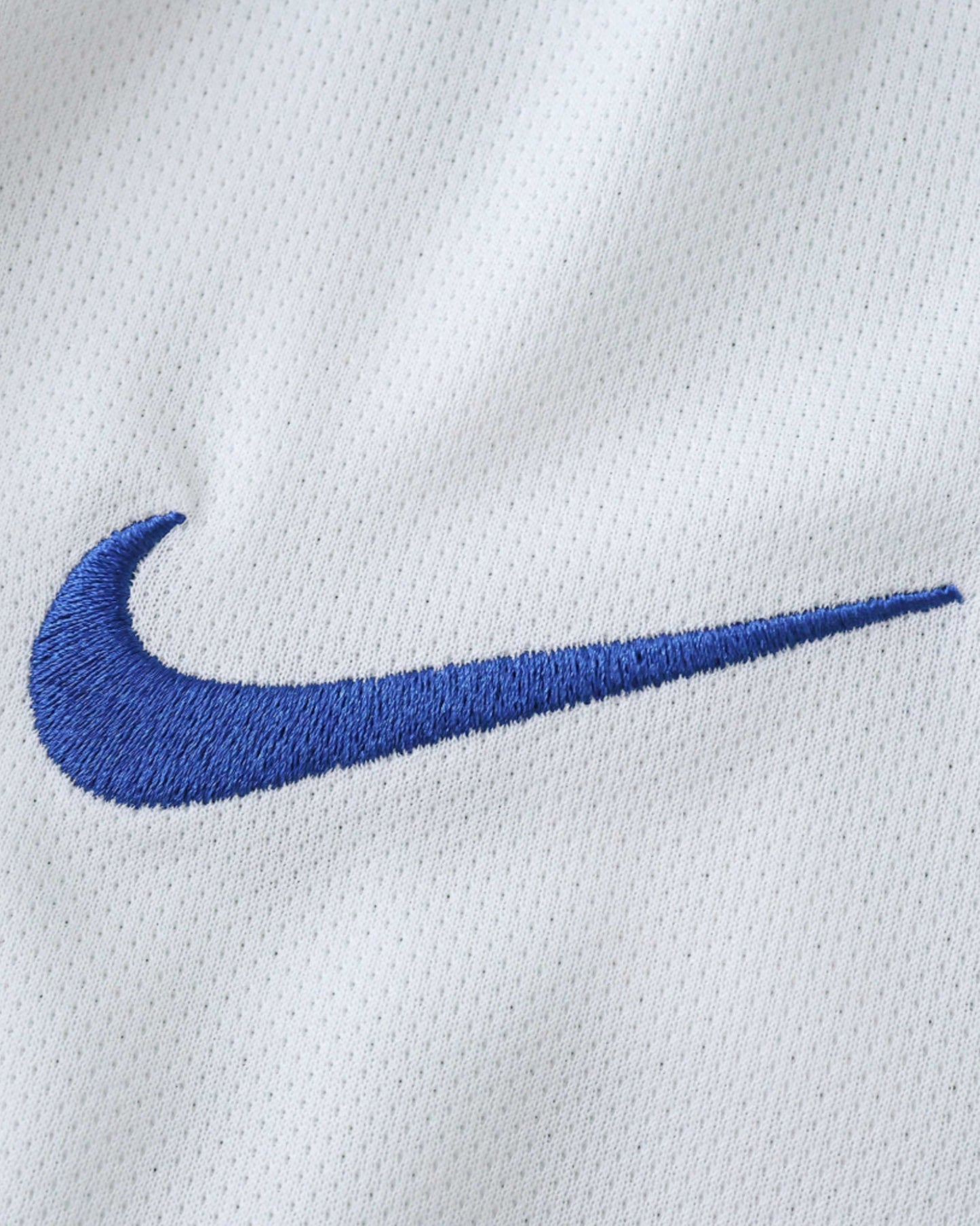 Inter Milan retro away football jersey 2010/11 detail of blue Nike swoosh on white fabric
