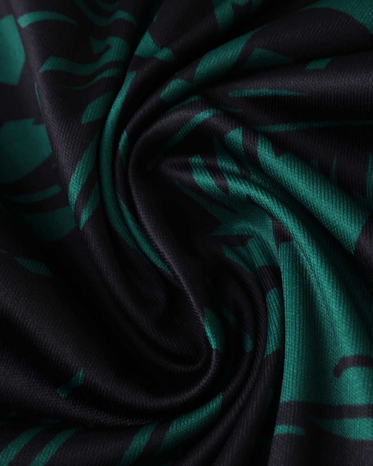 Italy x Stussy football jersey close-up of green and black Renaissance patterned fabric