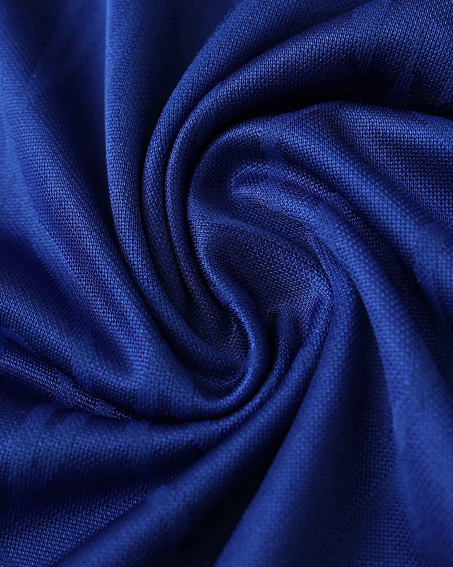 A close-up of draped royal blue fabric with a visible weave.