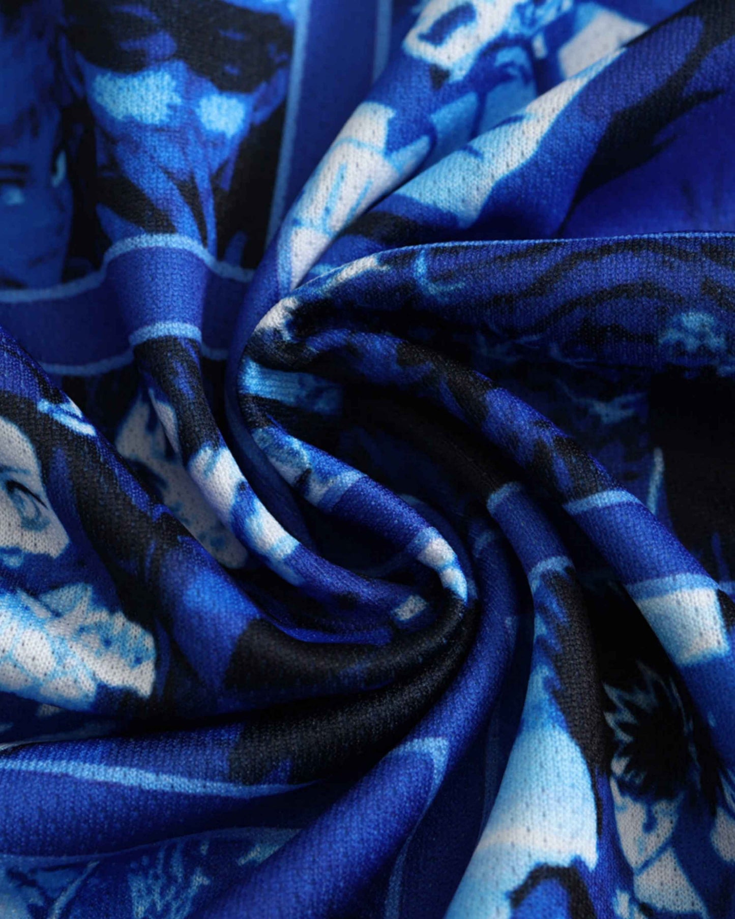 Blue fabric with a Japanese anime-inspired print.