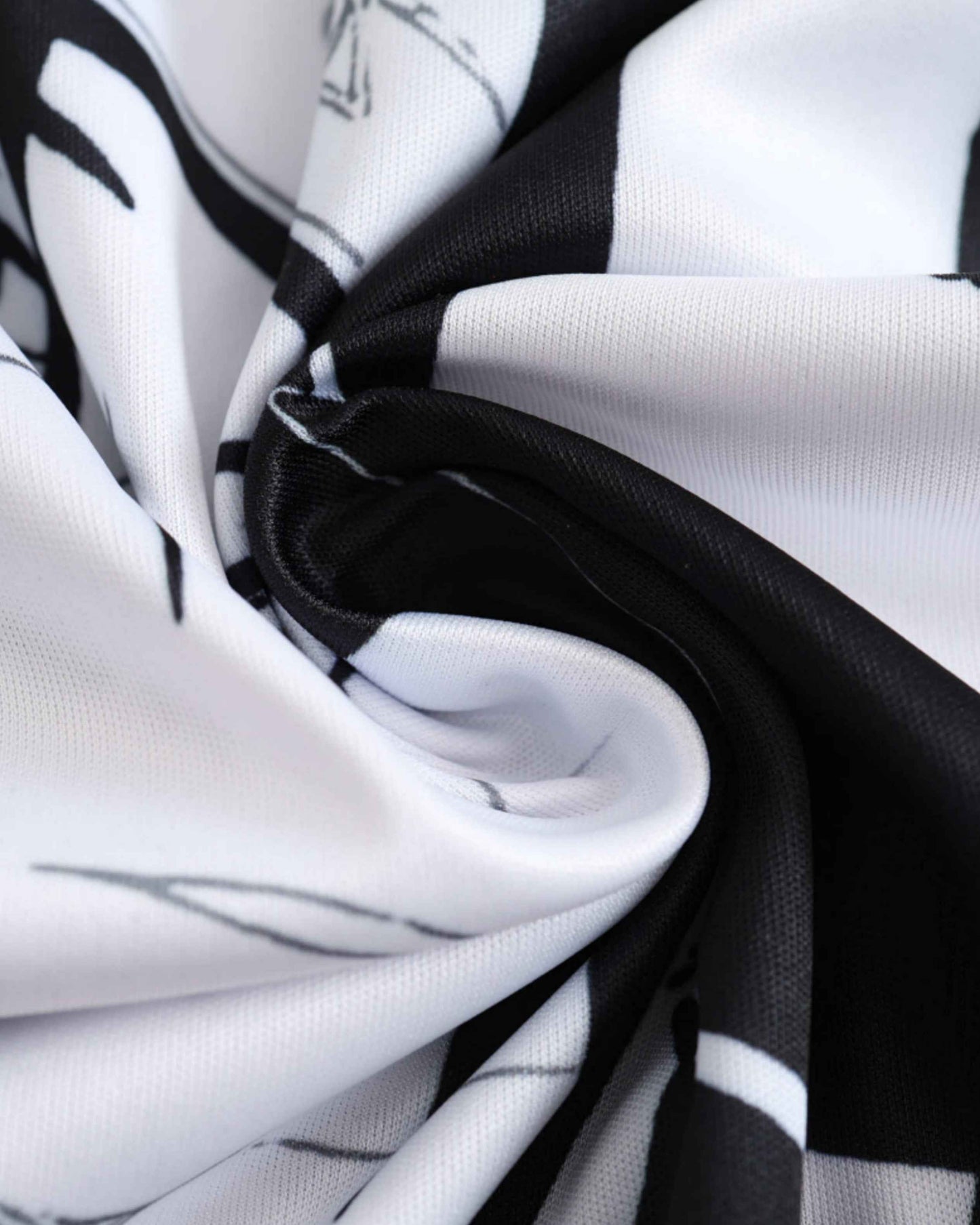 A close-up of black and white fabric with a pattern.