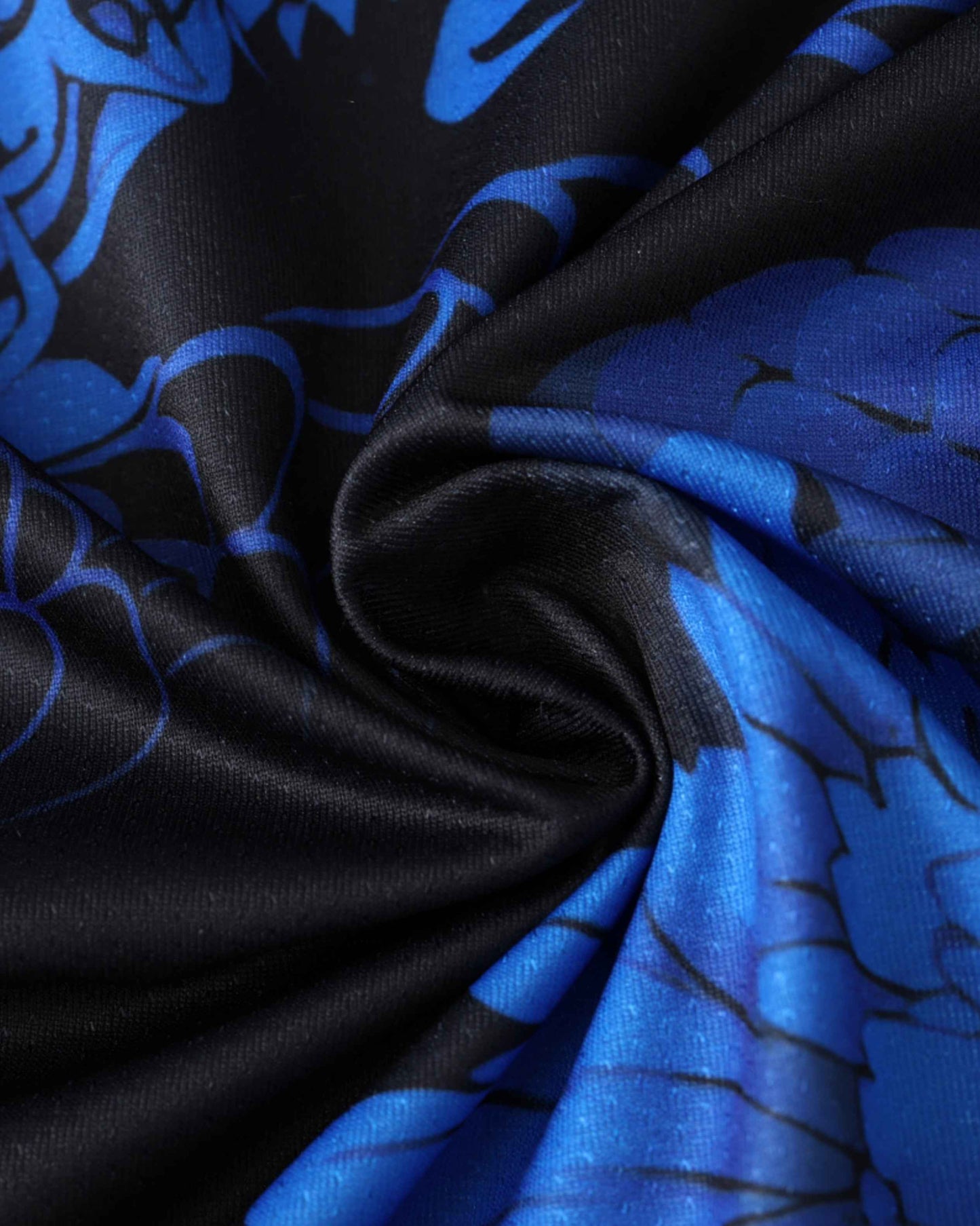 Black fabric with a blue floral pattern.