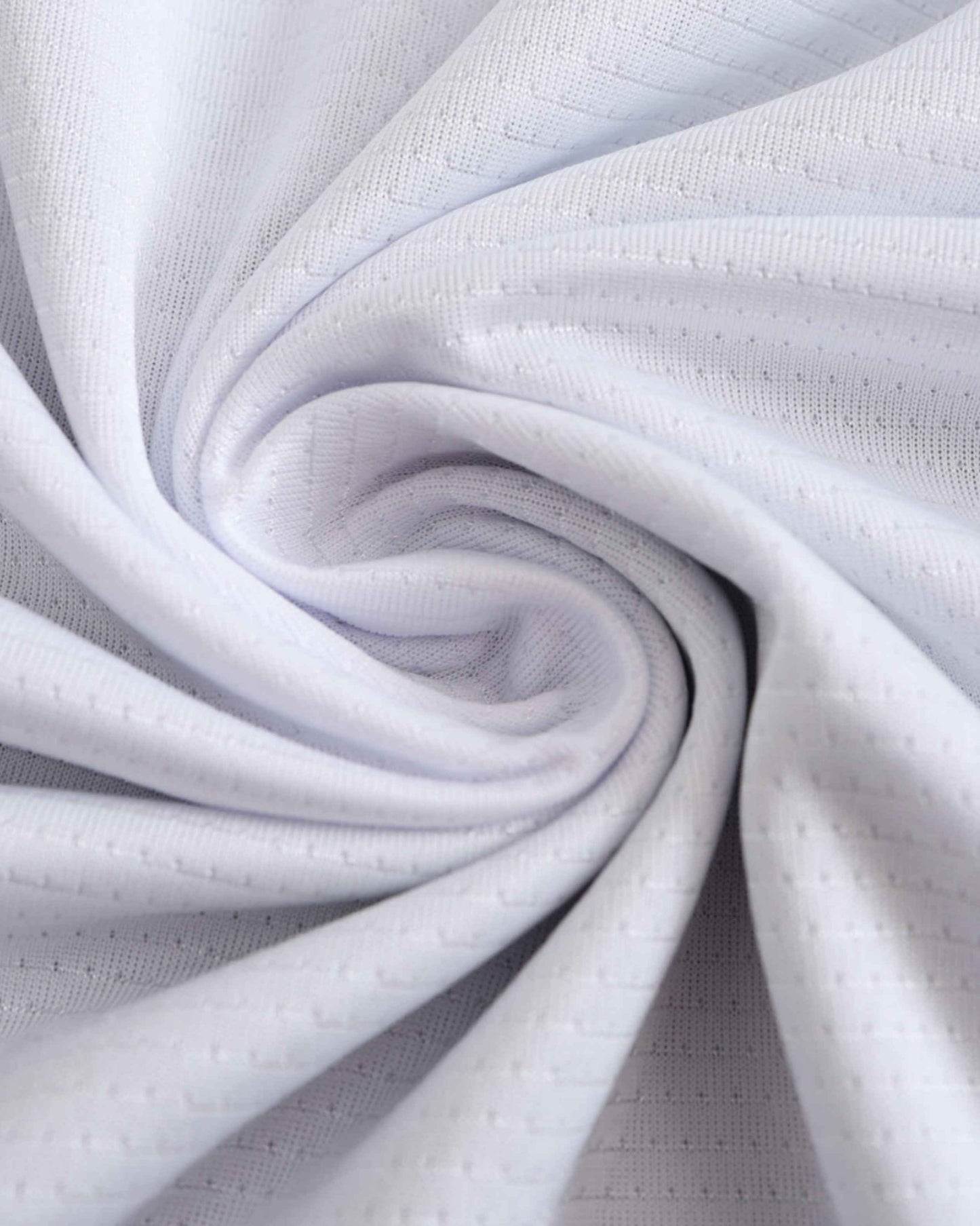 White fabric with a textured pattern and subtle perforations.