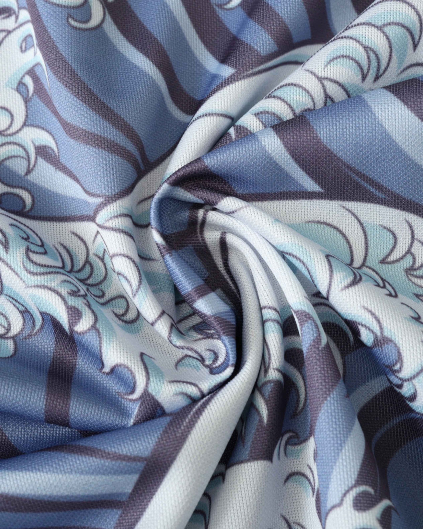 A close-up of blue and white fabric with a Japanese sea wave pattern.