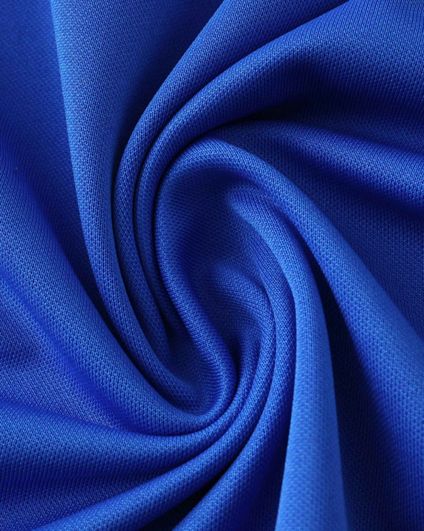 Blue fabric with a textured weave, folded into a swirl.