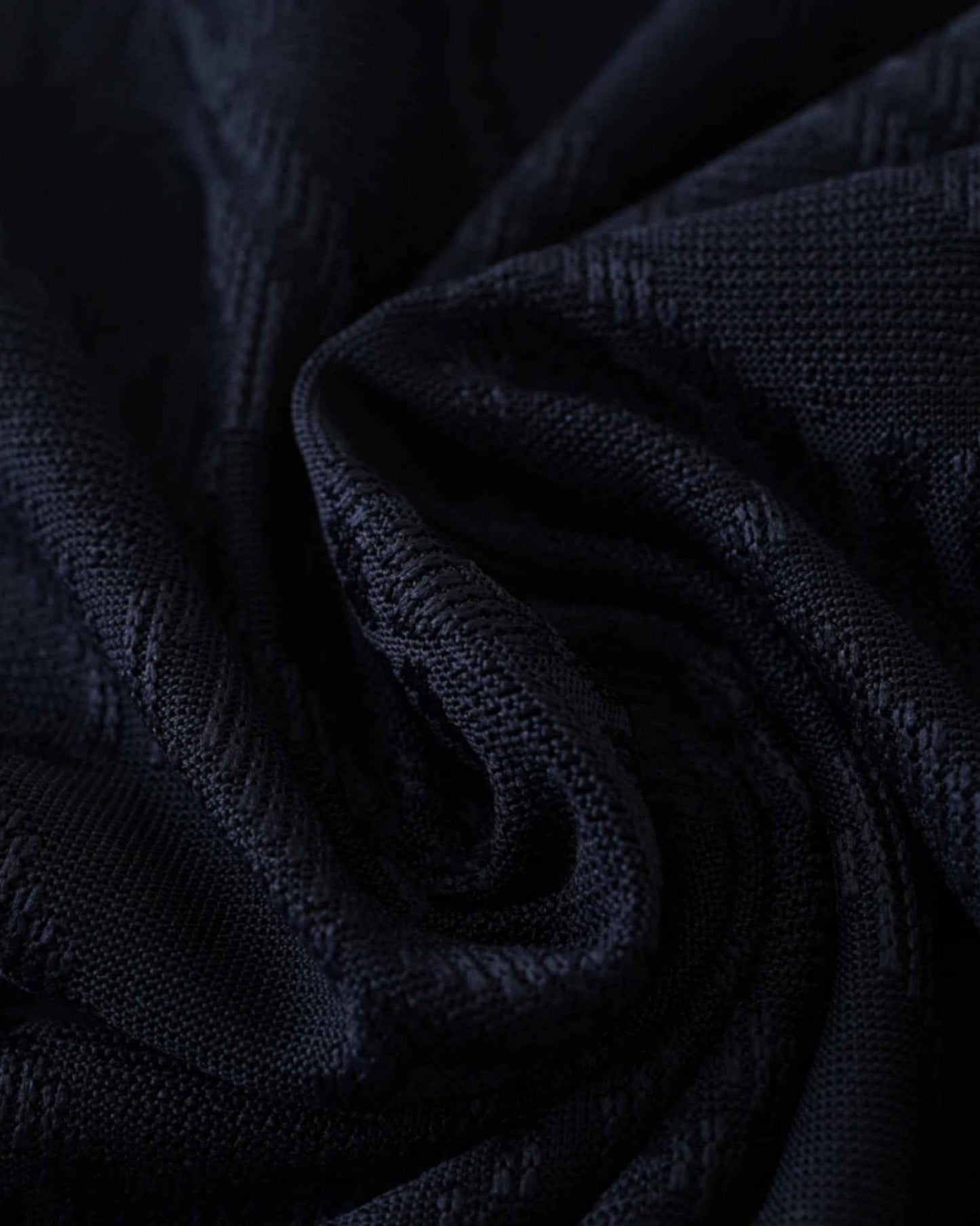 Close-up of the navy monogram fabric on the Juventus third 2024/25 jersey