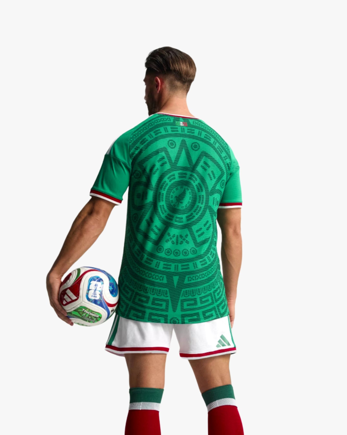 Man wearing green Mexico home football jersey 2026 with Aztec print and eagle crest