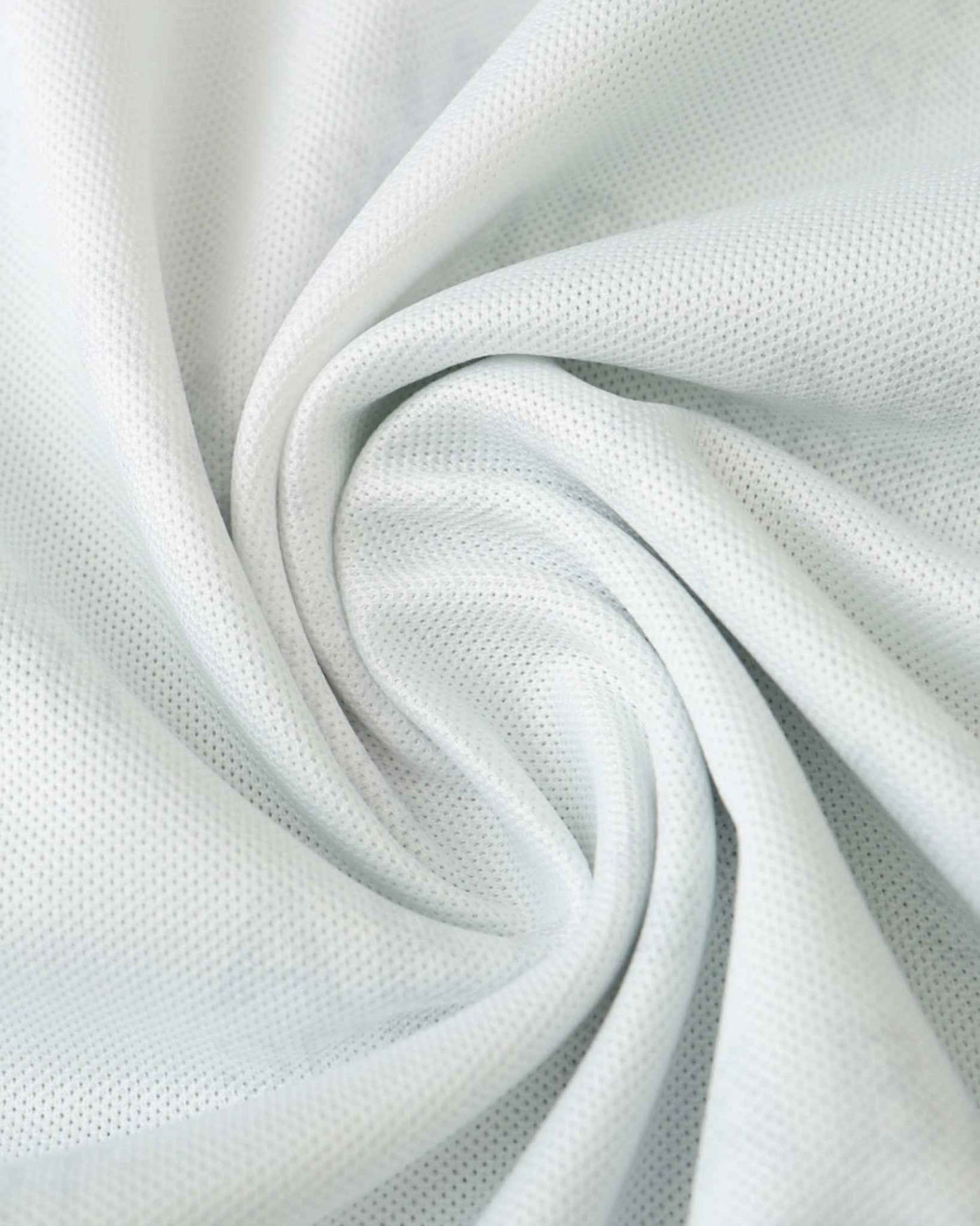 White textured fabric with a subtle mesh pattern, draped in soft folds.