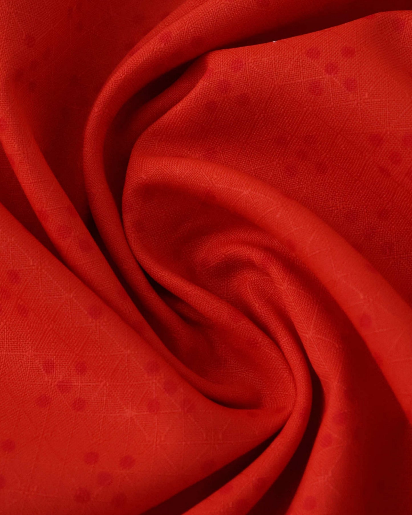 Close-up of red Portugal home football jersey 2025/26 fabric with diamond pattern