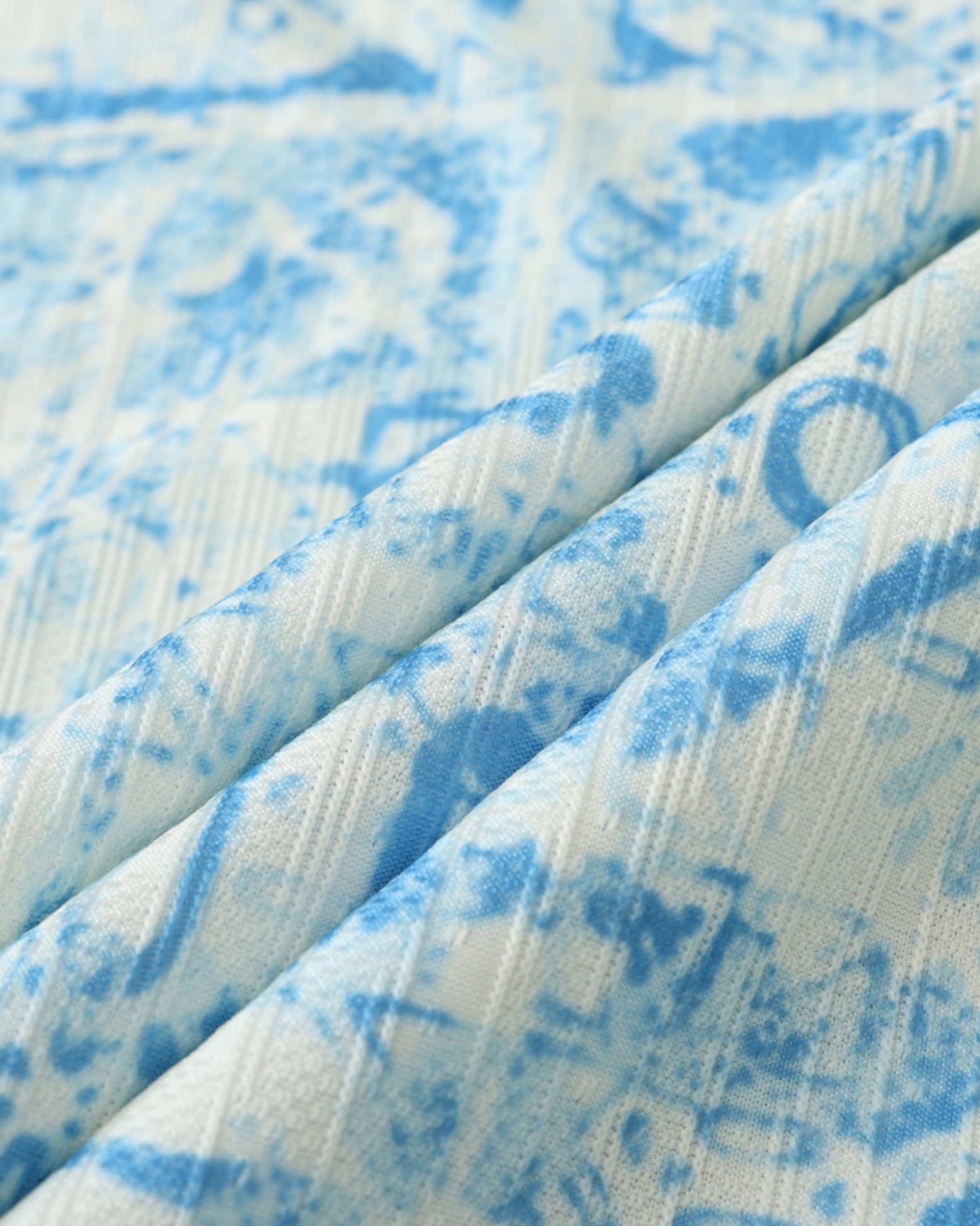 Close-up of white and blue azulejo fabric on Portugal UEFA away football jersey 2024/25
