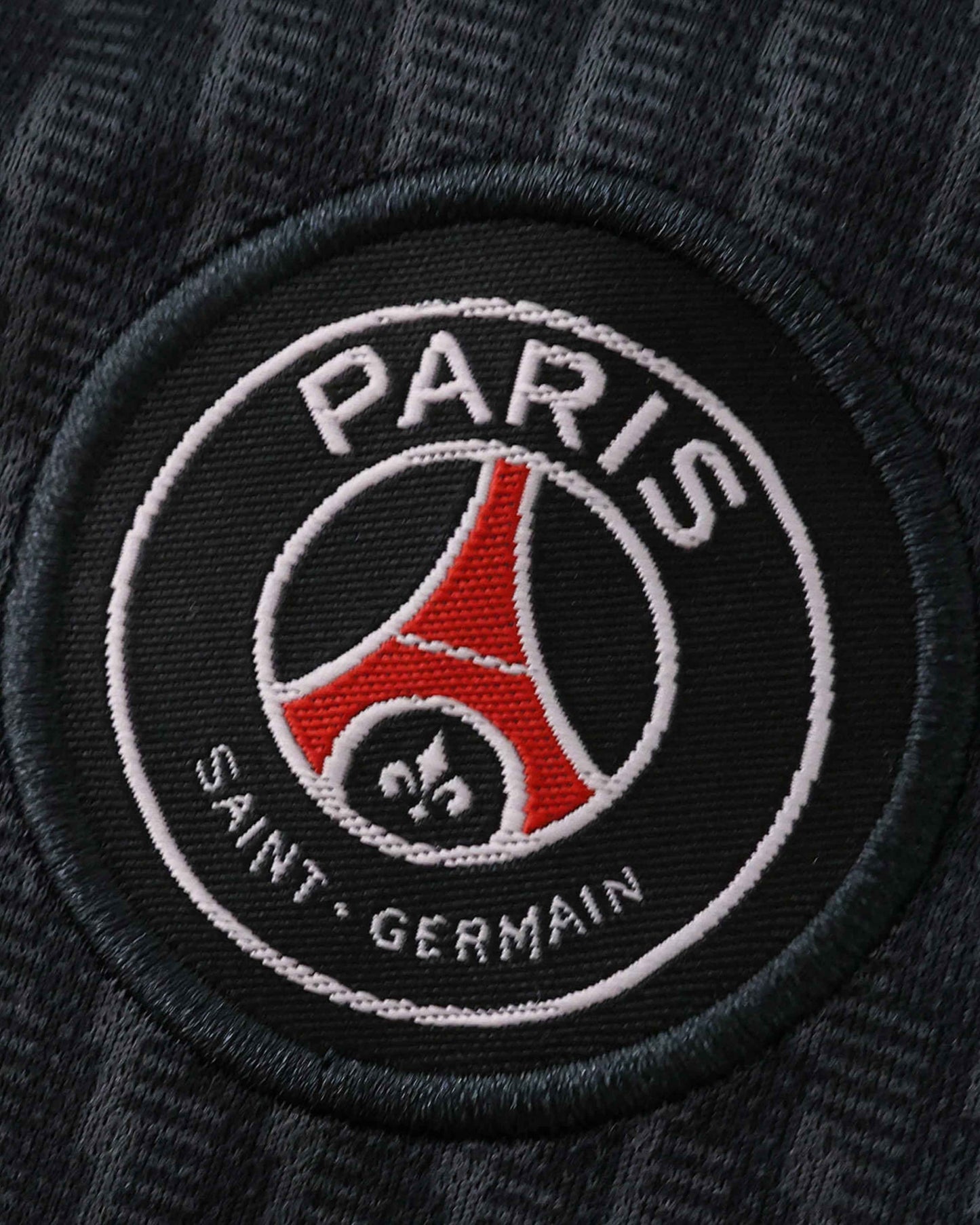 PSG Fourth kids football jersey 2025/26 back view of black Jordan kit with shorts