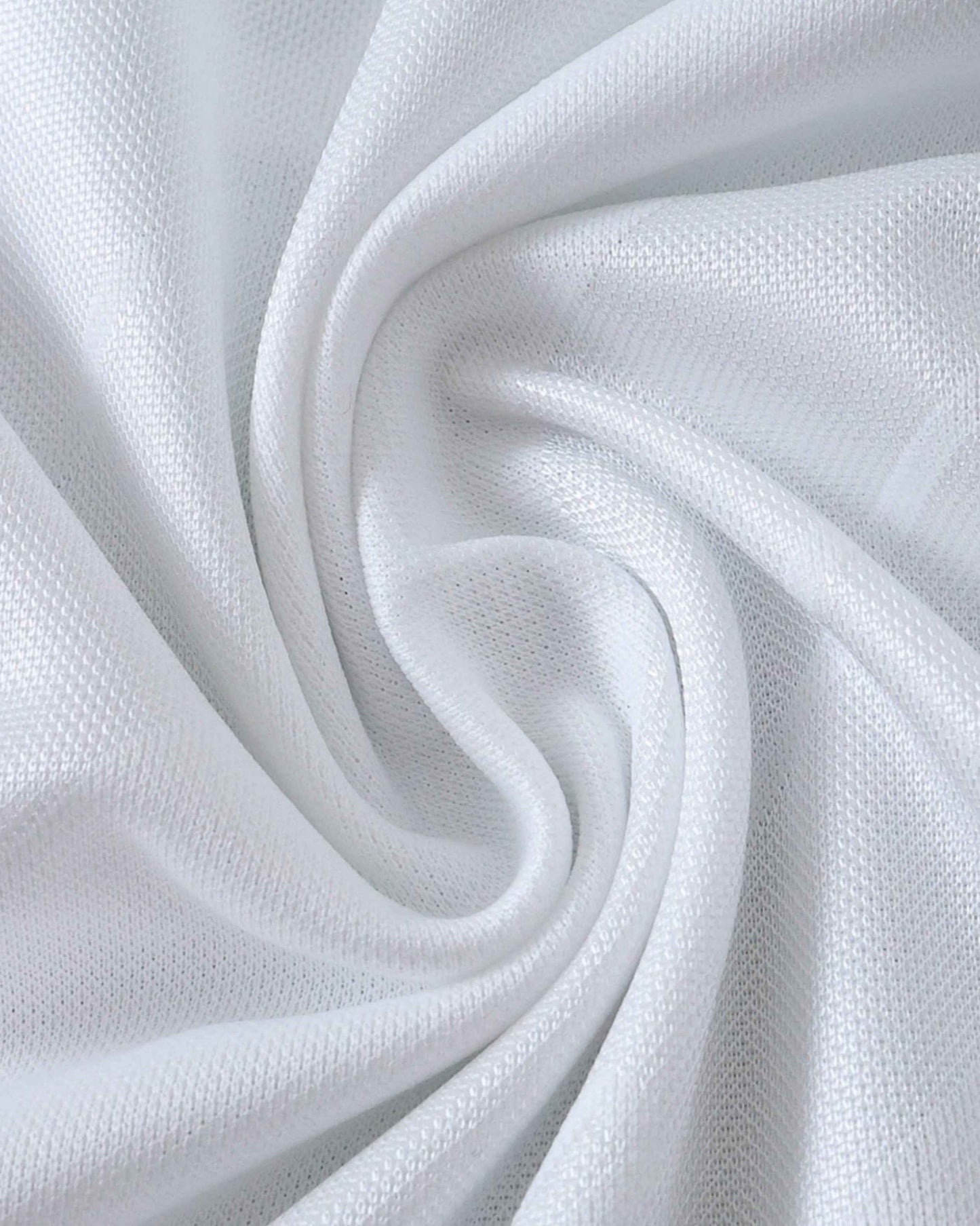 White fabric with a textured knit pattern, draped in soft folds.