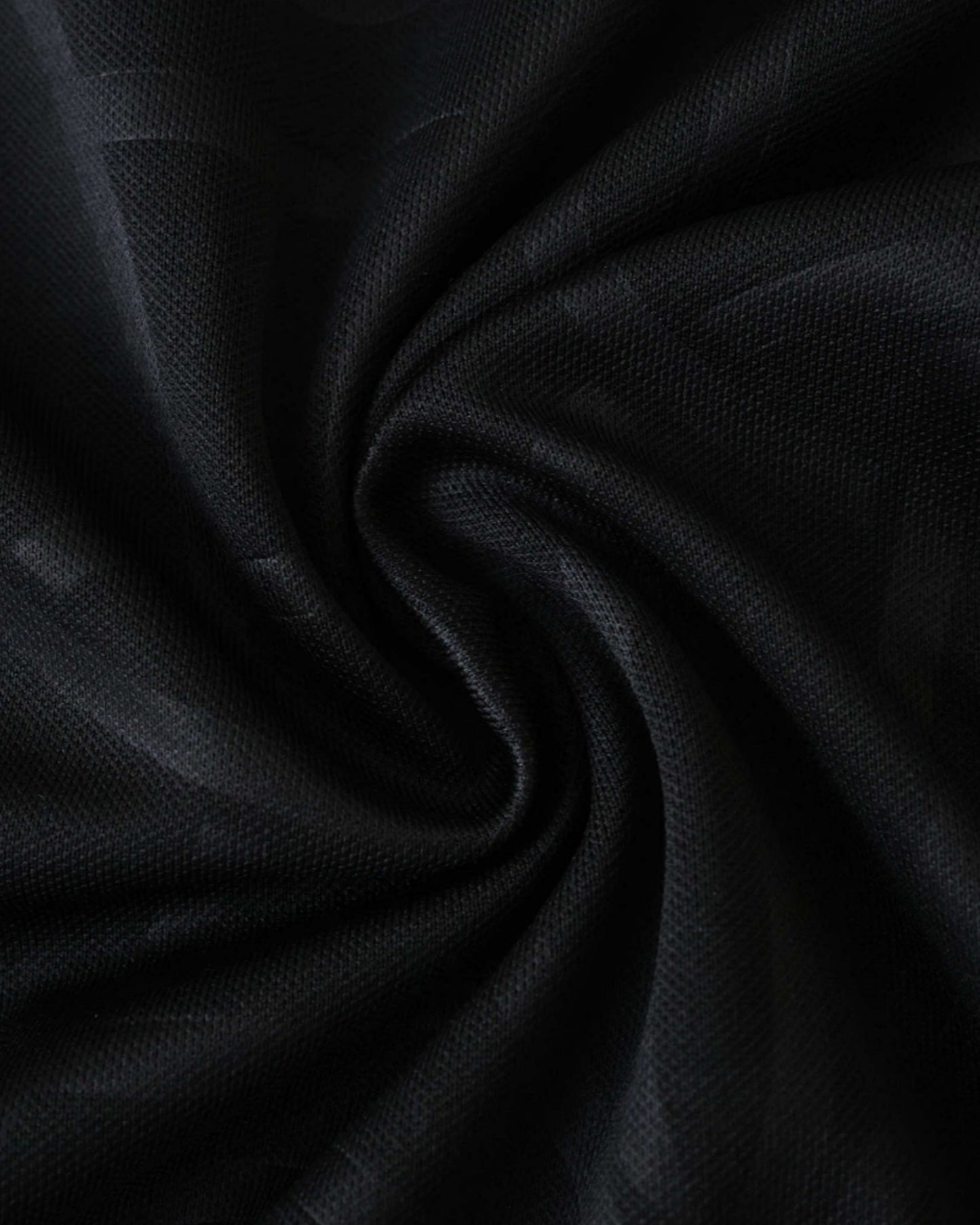 Textured black weave fabric detail of the PSG training football jersey 2025/26