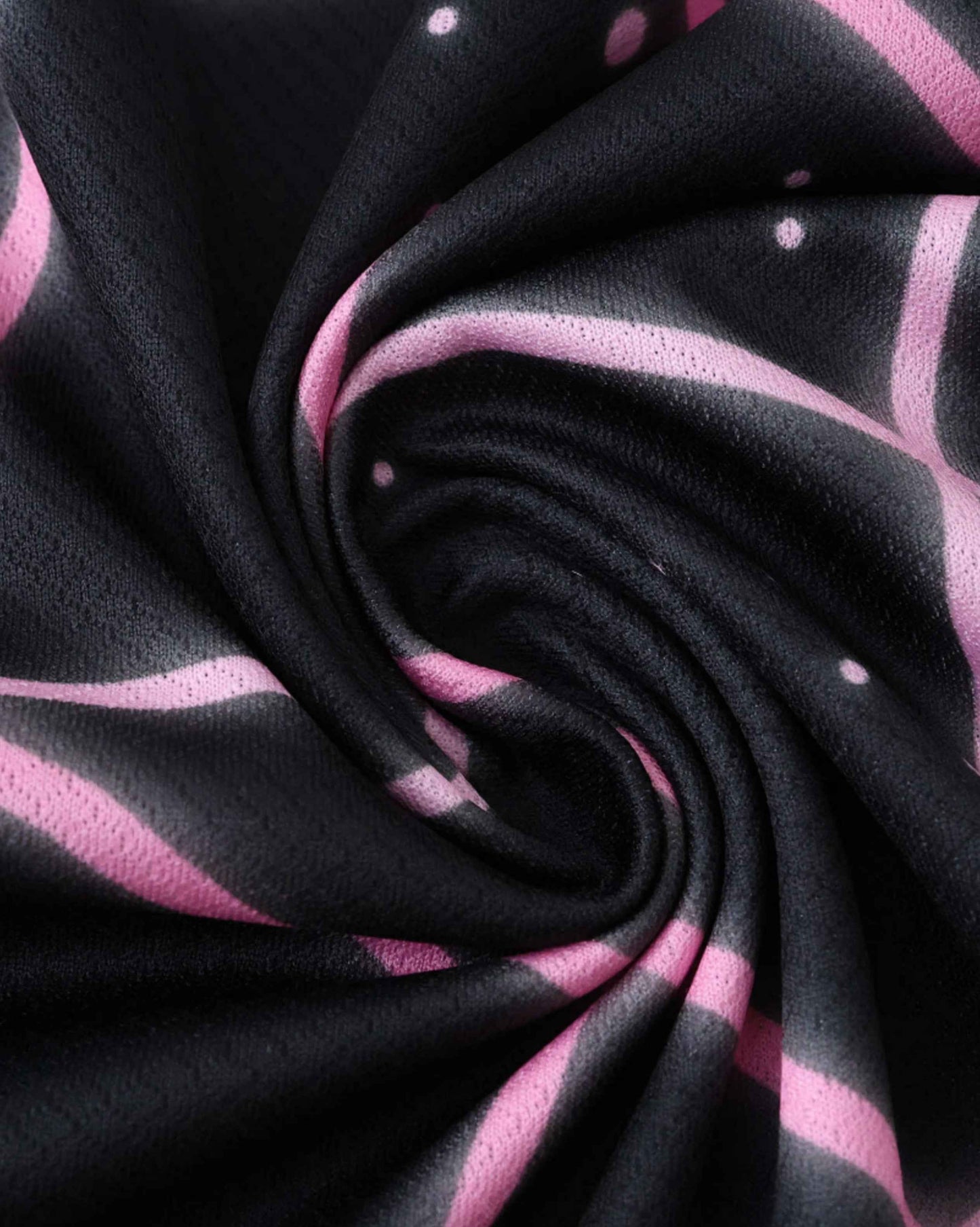 Black and pink striped soccer jersey and shorts with polka dots.