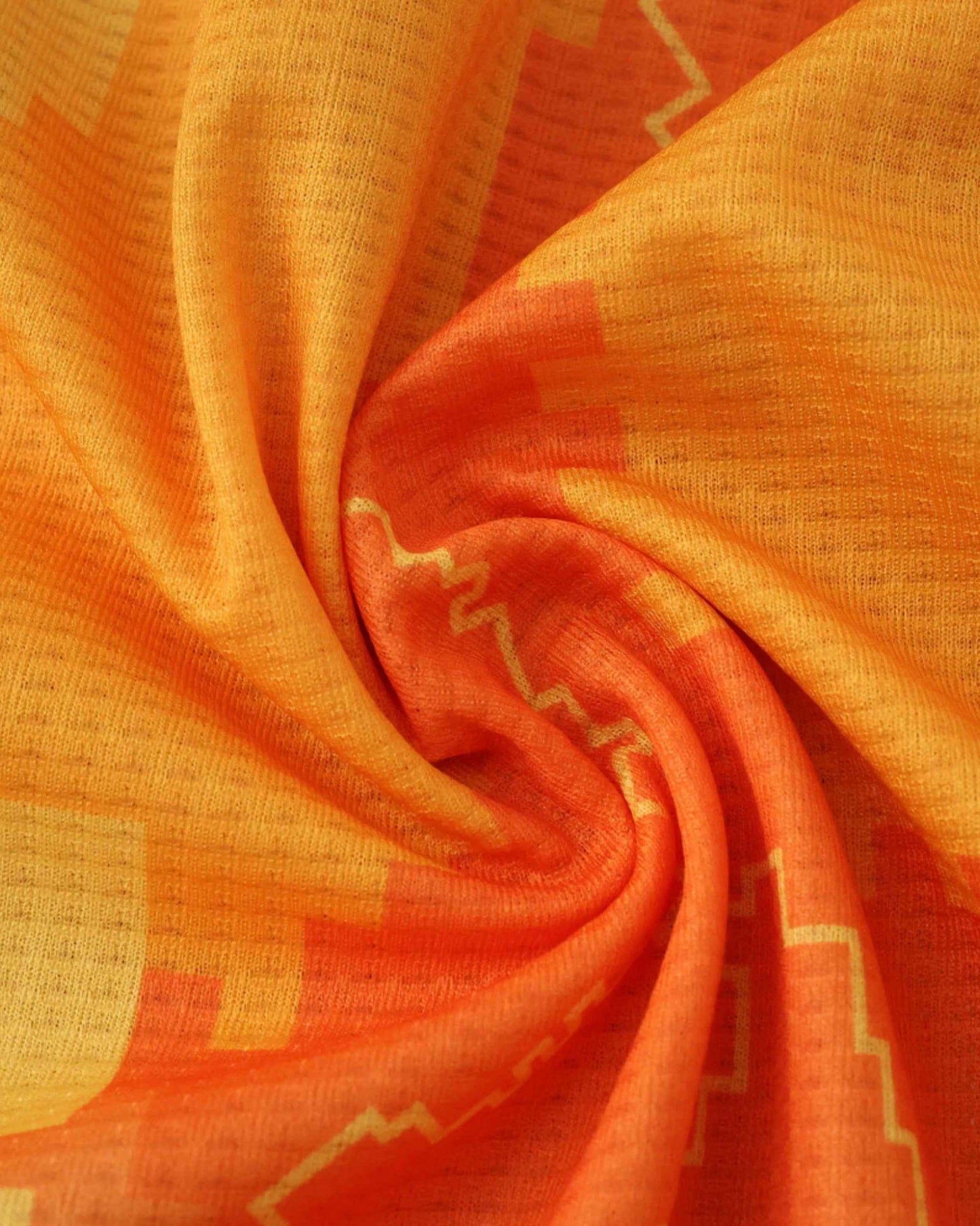 Orange and yellow fabric with a geometric pattern, swirled.